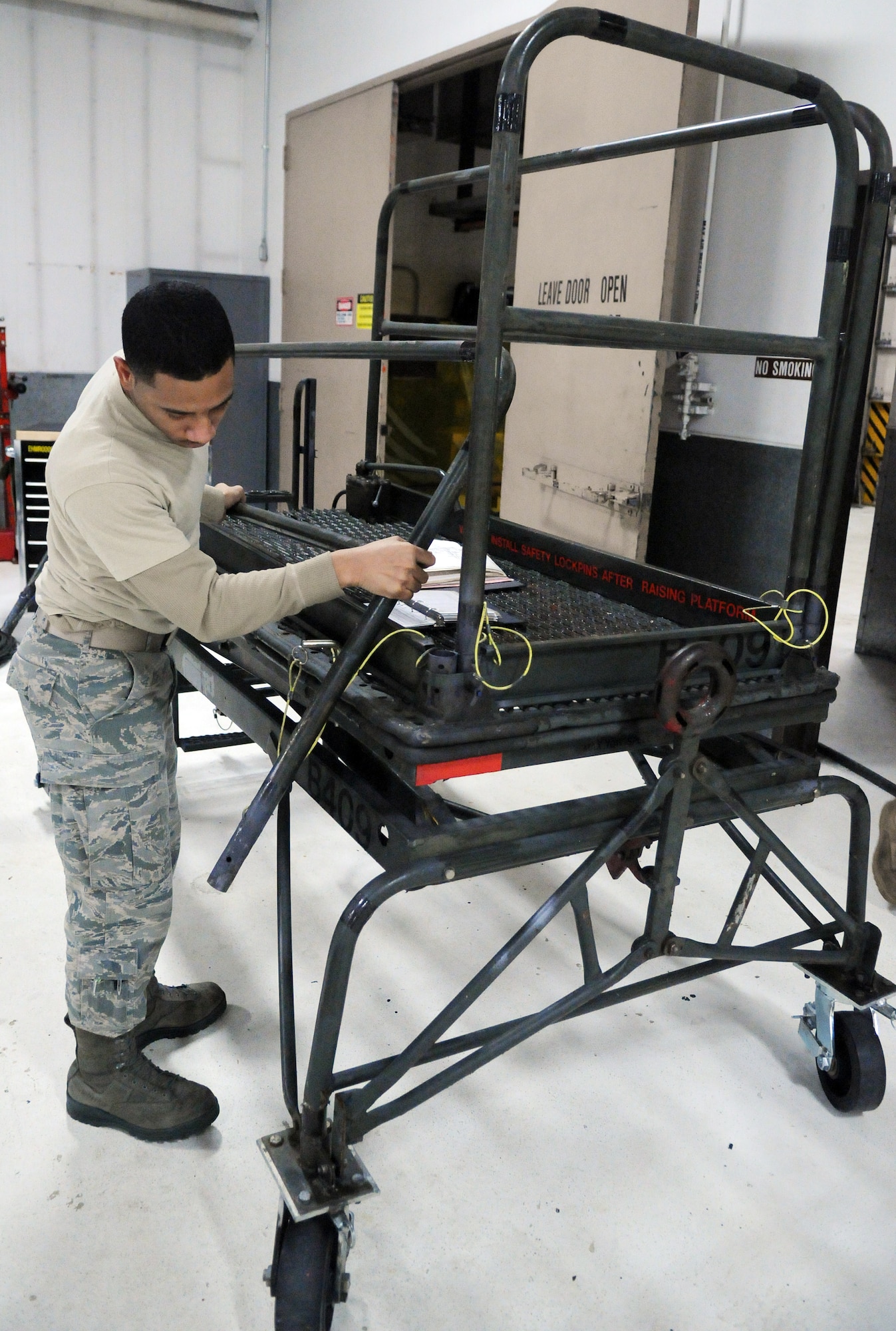 Airman 1st Class Reggie Wayne performs a periodic inspection on a B4 stand Feb. 16, 2011, Eielson Air Force Base, Alaska. PIs ensure equipment will function properly when used. Airman Wayne is a 354th Maintenance Squadron aerospace ground equipment maintainer. (U.S. Air Force photo/ Airman 1st Class Janine Thibault)