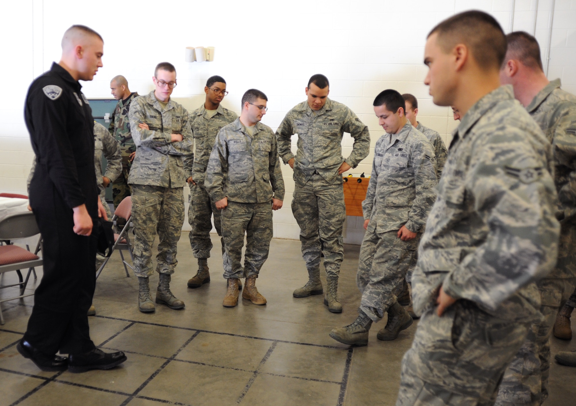 Staff Sgt. Chance Borgeson, U.S. Air Force Honor Guard drill team member, demonstrates drill team facing movements to McConnell’s Honor Guard members Feb. 14, 2011, McConnell Air Force Base, Kan. The U.S. Air Force Honor Guard is made up of Airmen from different career fields, enlisted and officer, who volunteer and showcase exceptional discipline and military professionalism. (U.S. Air Force photo/Senior Airman Maria A. Ruiz)