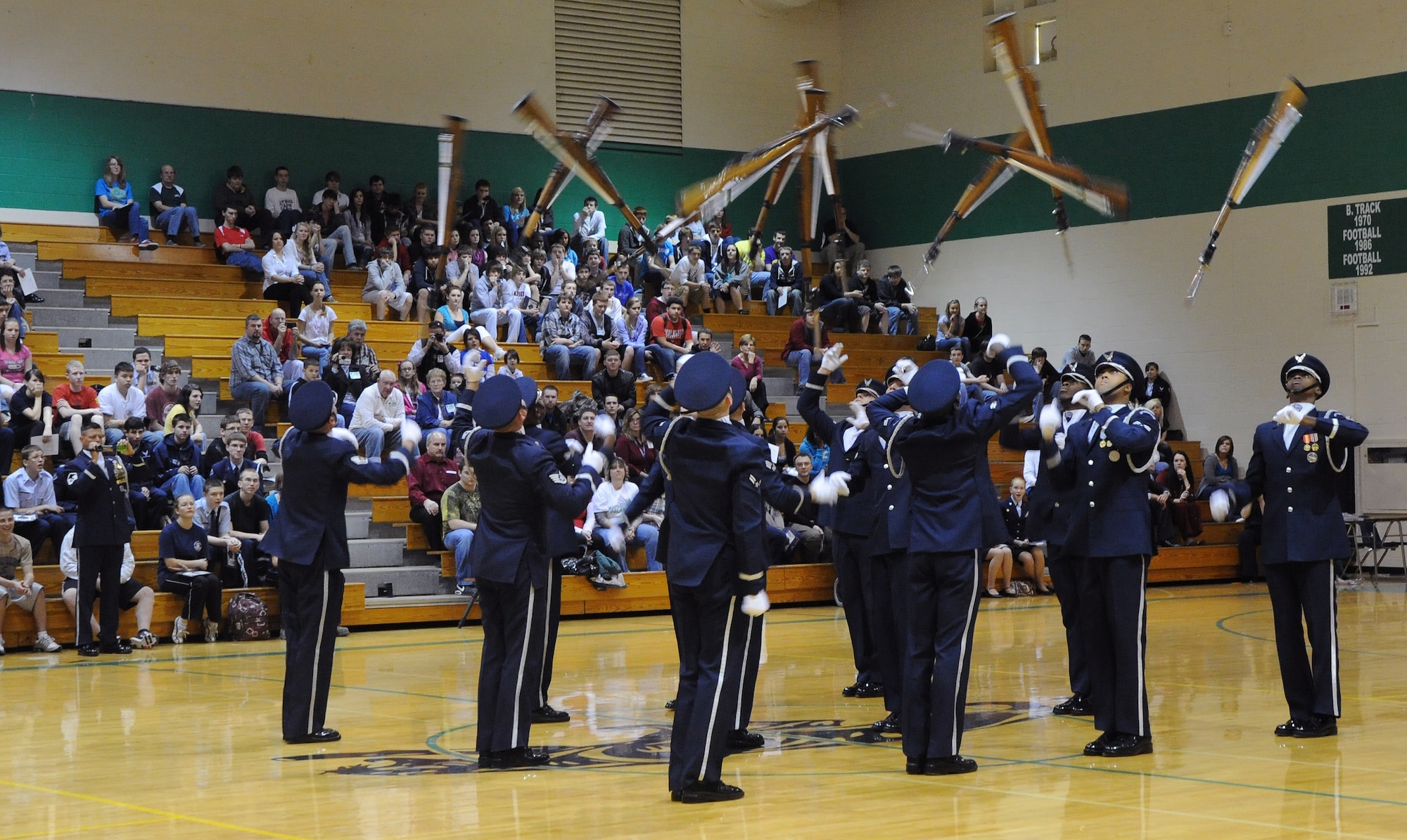 Members of the U.S. Air Force Honor Guard Drill Team perform at Derby High School Feb. 14, 2011, Derby, Kan. Staff Sgt. Kelly Webster, U.S. Air Force Honor Guard Drill Team NCOIC, graduated from Derby High School in 2004. (U.S. Air Force photo/Airman 1st Class Katrina M. Brisbin)