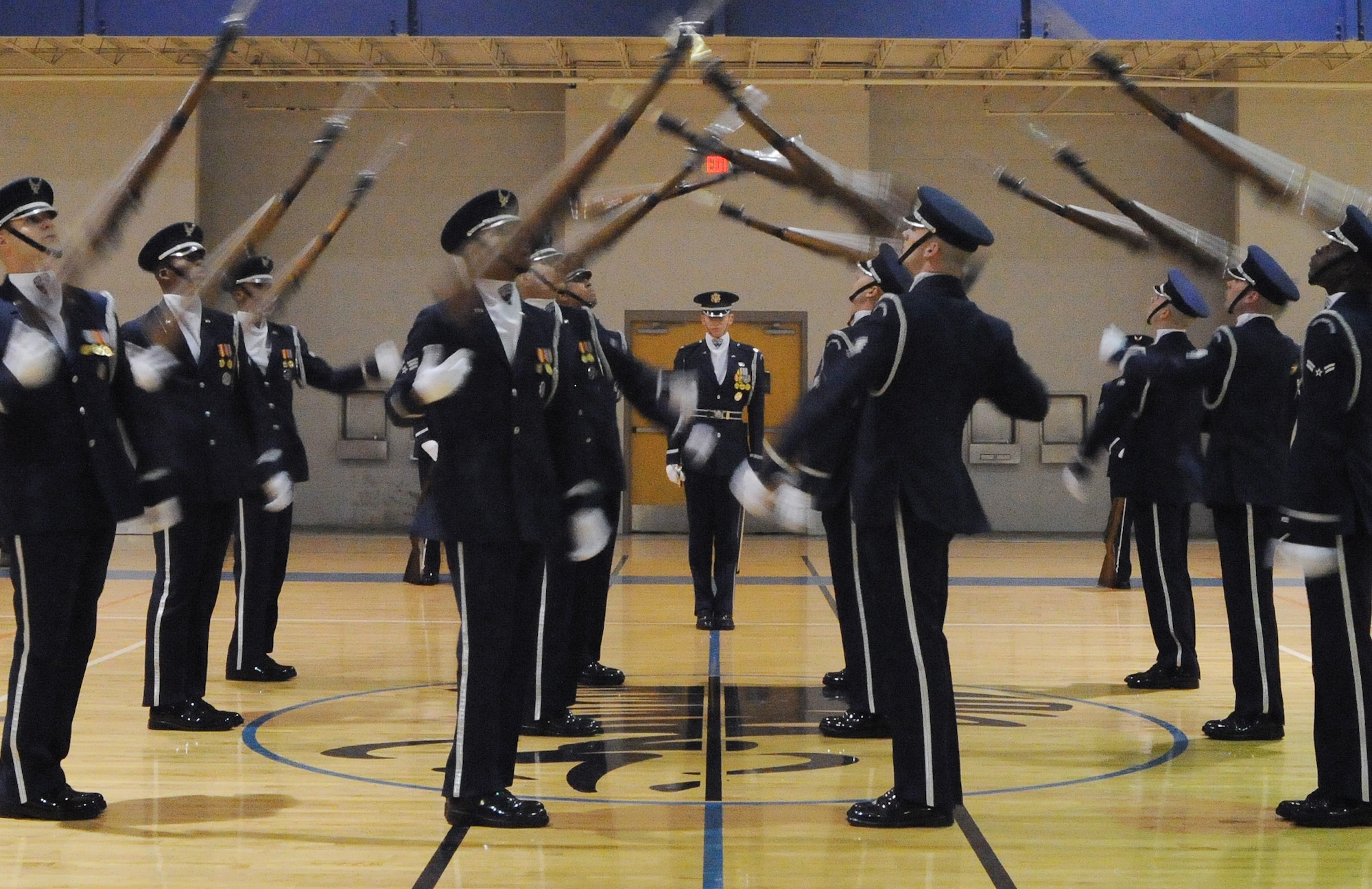Members of the U.S. Air Force Honor Guard Drill Team perform for Team McConnell members Feb. 14, 2011, McConnell Air Force Base, Kan. The Air Force Honor Guard Drill Team is the traveling component of the U.S. Air Force Honor Guard. The honor guard showcases the precision of today's Air Force to recruit, retain and inspire Airmen about the Air Force mission. (U.S. Air Force photo/Airman 1st Class Katrina M. Brisbin)