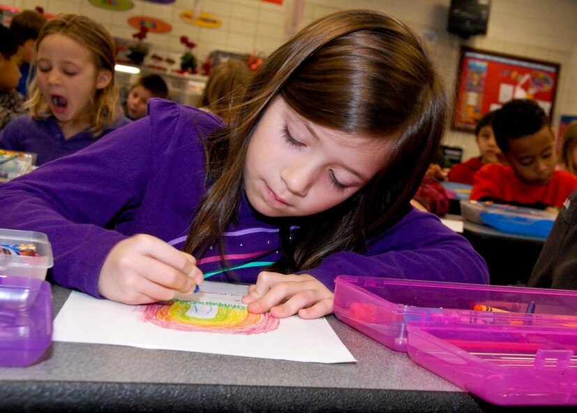 Abbie Break concentrates on coloring her thank you card Feb. 16 at Shalimar Elementary. First grade students made cards for local retired service-members who were injured during their time of service. More than 90 thank you cards will be handed out at the VFW Post 7674 in Fort Walton, Beach, Fla., Feb. 21st. (U.S. Air Force photo/Sachel Seabrook)