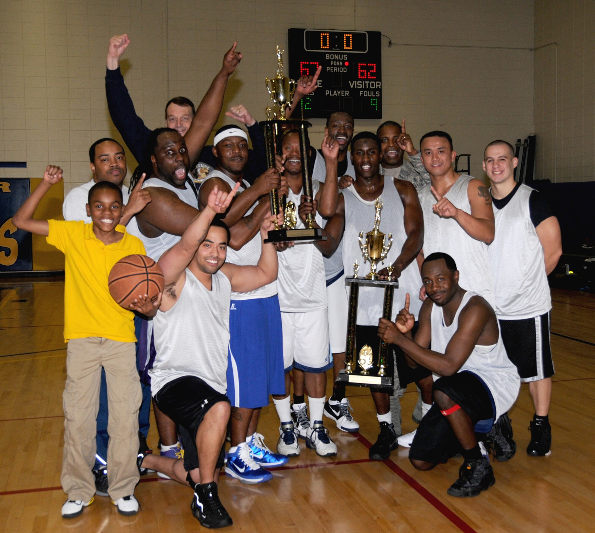 The Dragon Medics savor their basketball championship.  (U.S. Air Force photo by Kemberly Groue)