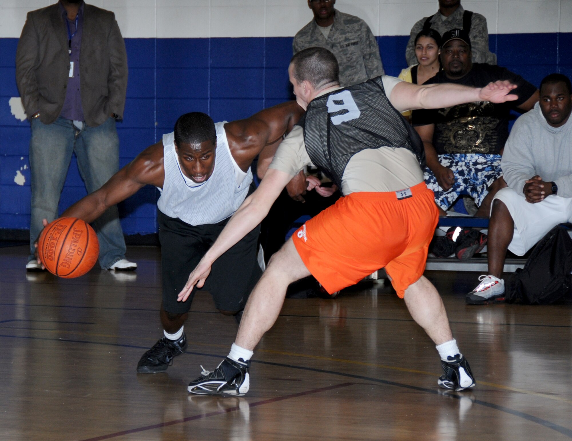 Kwamina Boyd, left, 81st MDG, drives the ball around Buckston Battles, 338th TRS.  (U.S. Air Force photo by Kemberly Groue)