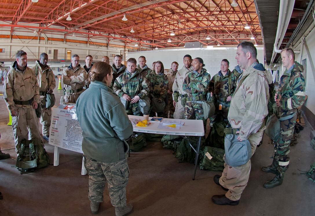 Staff Sgt. Leia Bernhard, 433rd CES emergency management instructor, Lackland AFB, Texas, instructs a group on decontamination procedures of 403rd Wing Citizen Airmen Feb. 13, during the Unit Training Assembly Reservists from the 403rd Wing continue to train for the January 2012 Operational Readiness Inspection. (U.S. Air Force photo by Dhiana McKaig)