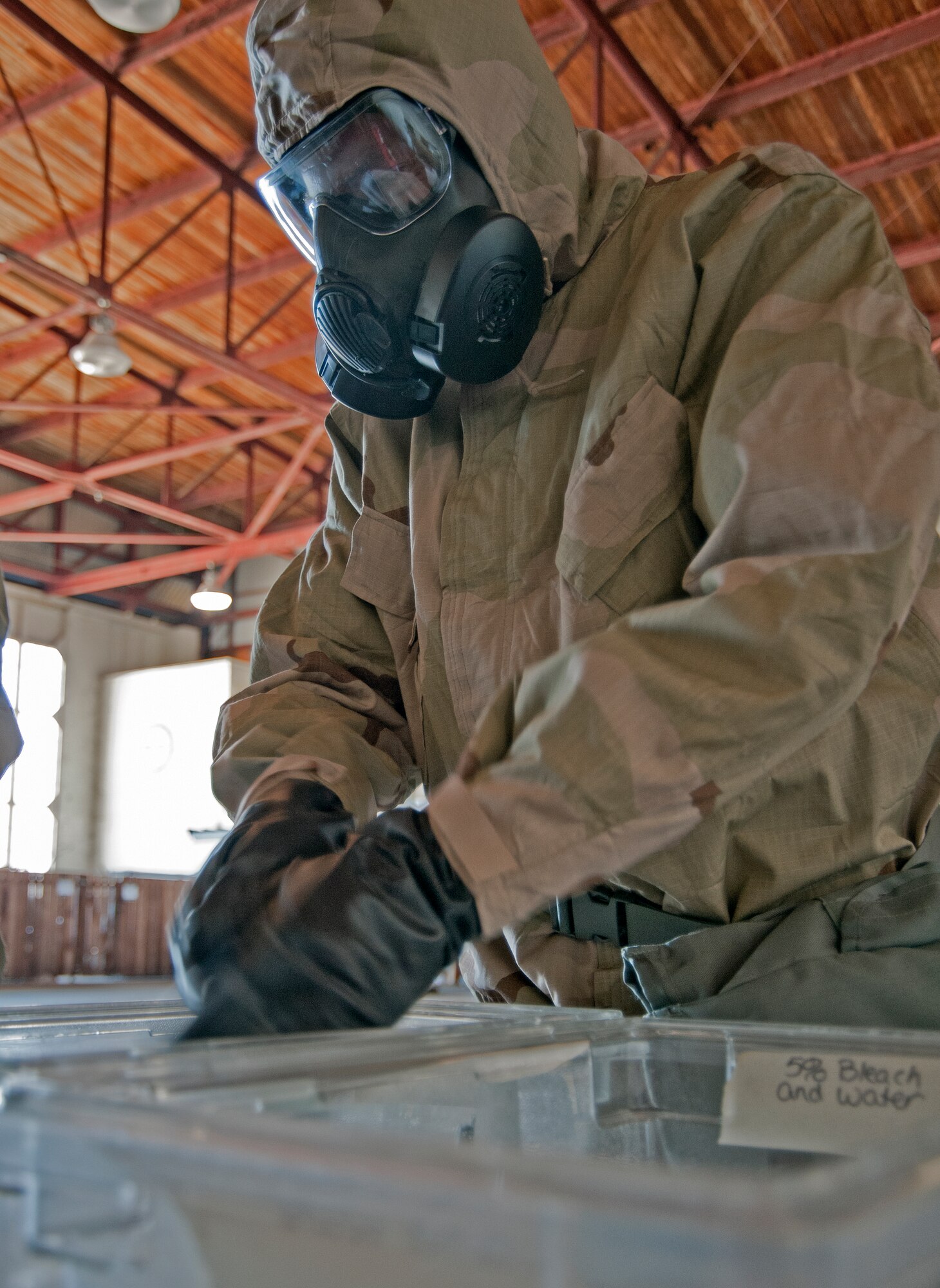 Lt. Col. Rob Stanton, 403rd Operations Group deputy commander, exercises washing chemicals from his hands Feb. 13, during the Unit Training Assembly.  Reservists from the 403rd Wing continue to train for the January 2012 Operational Readiness Inspection. (U.S. Air Force photo by Dhiana McKaig)