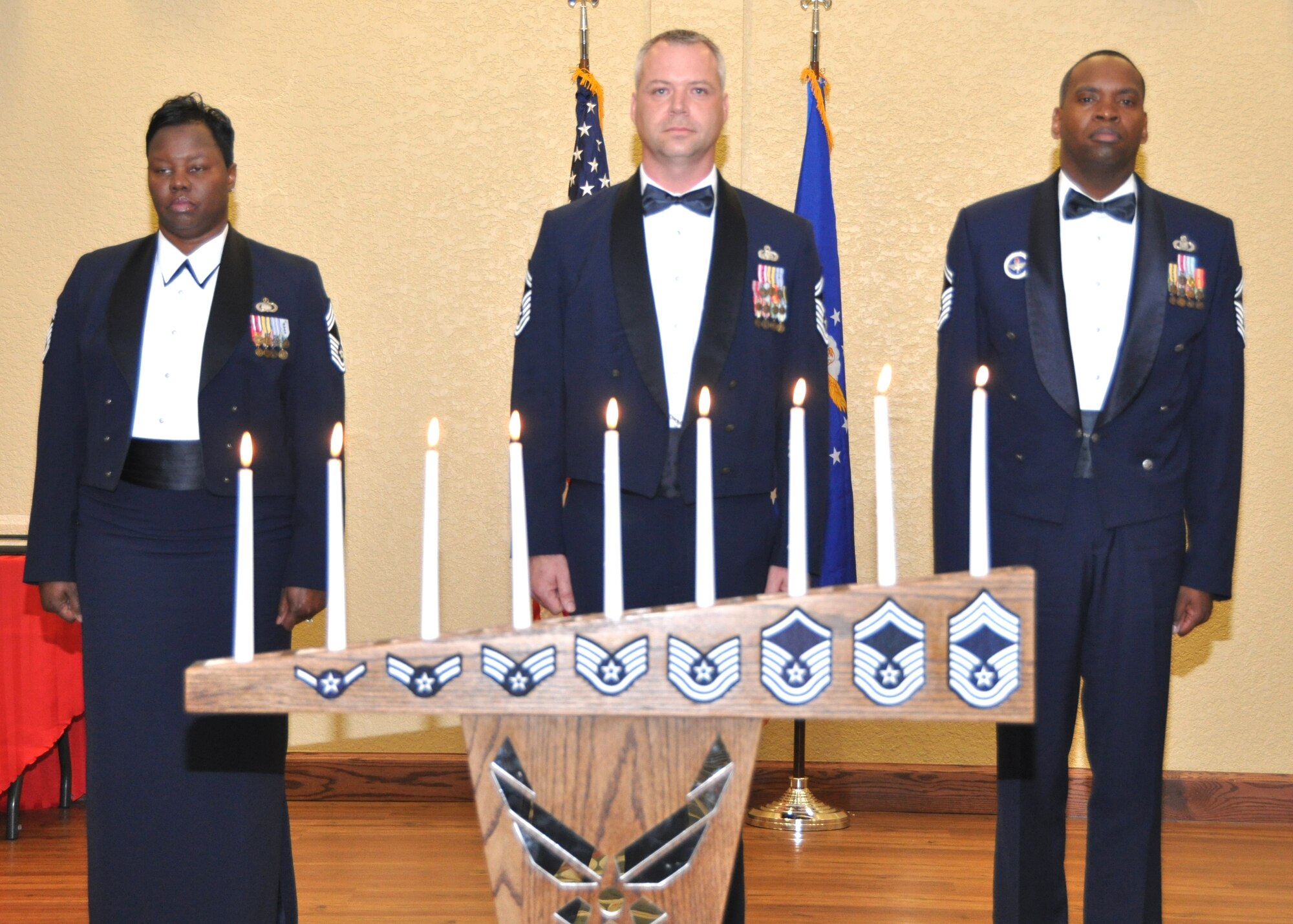 From left, Chief Master Sgt. Lisa Boothe, 81st Comptroller Squadron, and Senior Master Sgts. Thomas Cimenski, 338th Training Squadron, and Anthony Pearson, 334th TRS, were honored at Saturday’s chief master sergeant induction ceremony at
the Bay Breeze Event Center.  (U.S. Air Force photo by Steve Pivnick)