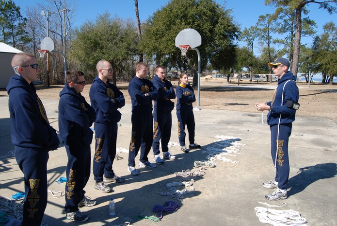 An officer candidate demonstrates basic sailing knots to his fellow officer candidates and midshipmen at the Short Stay Outdoor Recreation Area in Moncks Corner, S.C., Feb. 12. 