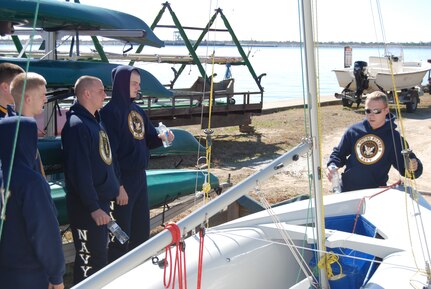 An officer candidate identifies the parts of a sailboat for his fellow midshipmen and officer candidates at Short Stay Outdoor Recreation Area in Moncks Corner, S.C., Feb. 12.   