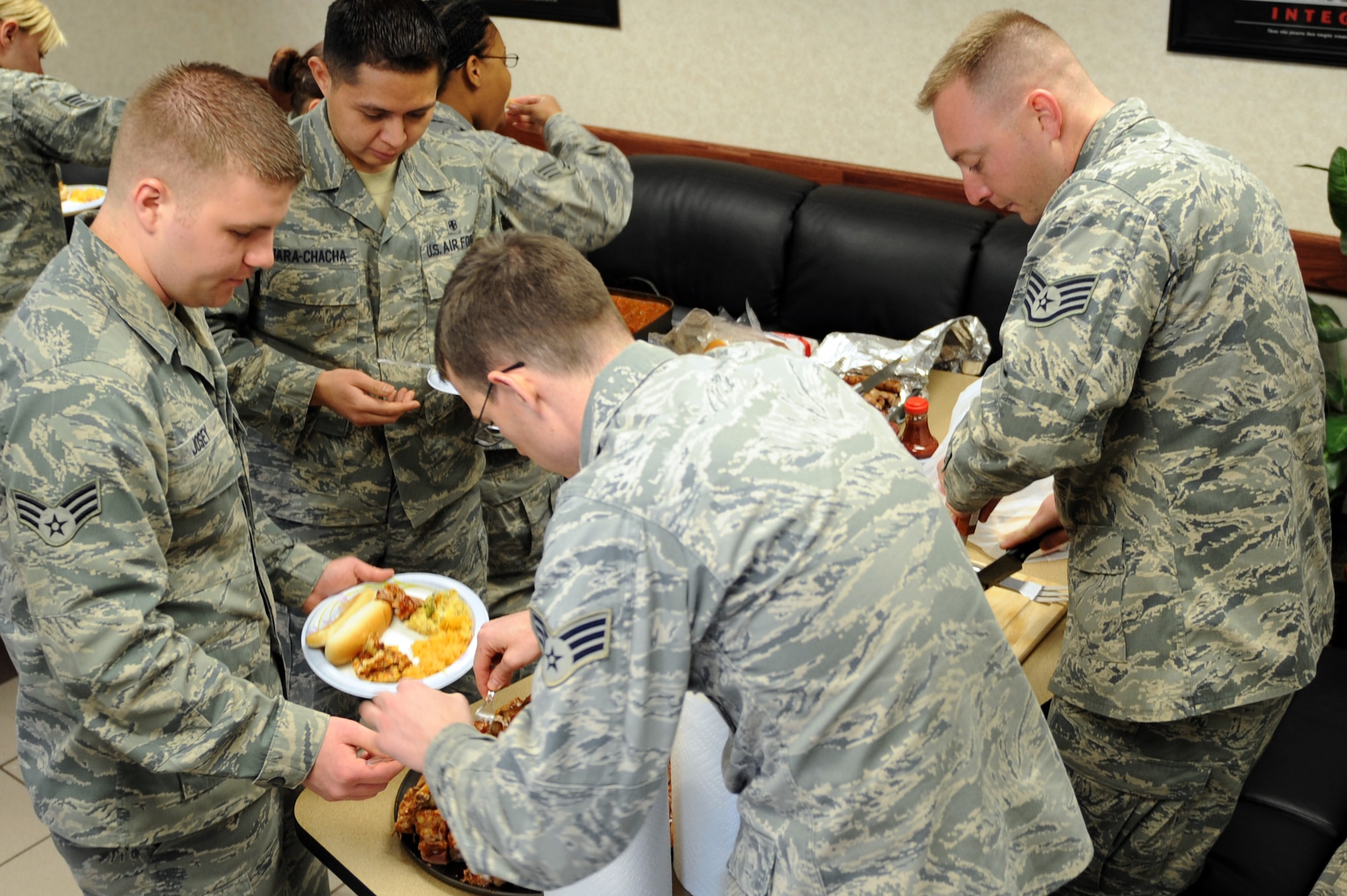 Students of Airman Leadership School class 11-B participate in a diversity luncheon Jan. 21, 2011 at Scott Air Force Base, Ill. The diversity luncheon is tied into the Global Diversity class. Students and staff bring in food that is either a family tradition or a dish from their cultural background. (U.S. Air Force photo/Staff Sgt. Teresa M. Jennings)