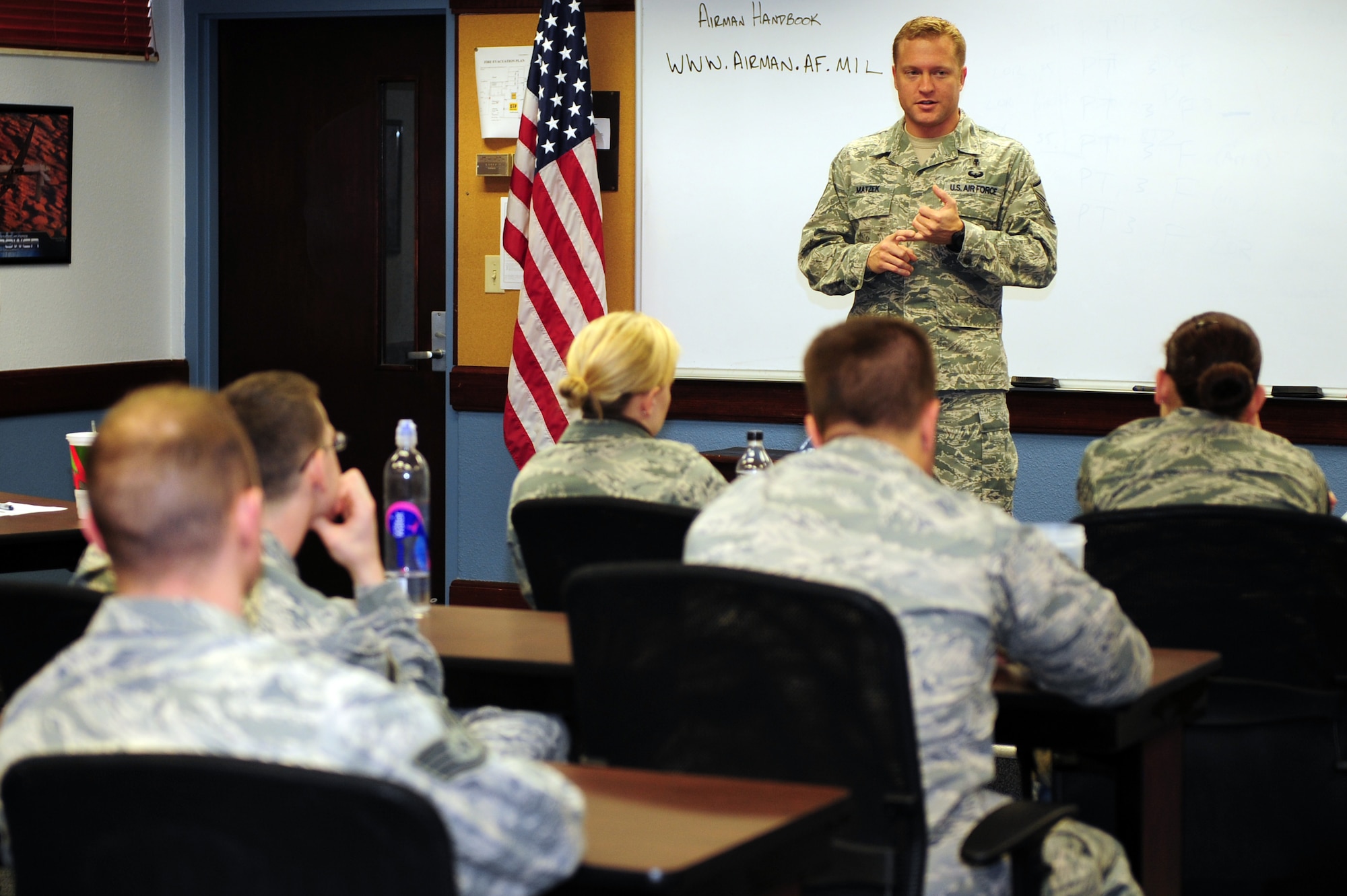 Master Sgt. Eric Matzek, 375th Force Support Squadron’s Airman Leadership School commandant, speaks with ALS class 11-B during their last lesson before graduation Jan. 9, 2011 at Scott Air Force Base, Ill. The students will spend their last day filling out critique sheets and preparing for their graduation ceremony the following day. (U.S Air Force photo/Staff Sgt. Teresa M. Jennings)