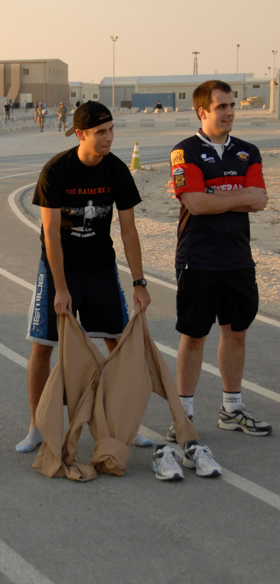 British servicemember Tom Lake puts on a flight suit during his participation in the fancy dress competition during the old school sports event on base Feb. 12. (U.S. Air Force photo/Tech Sgt. Ray Winstead)
