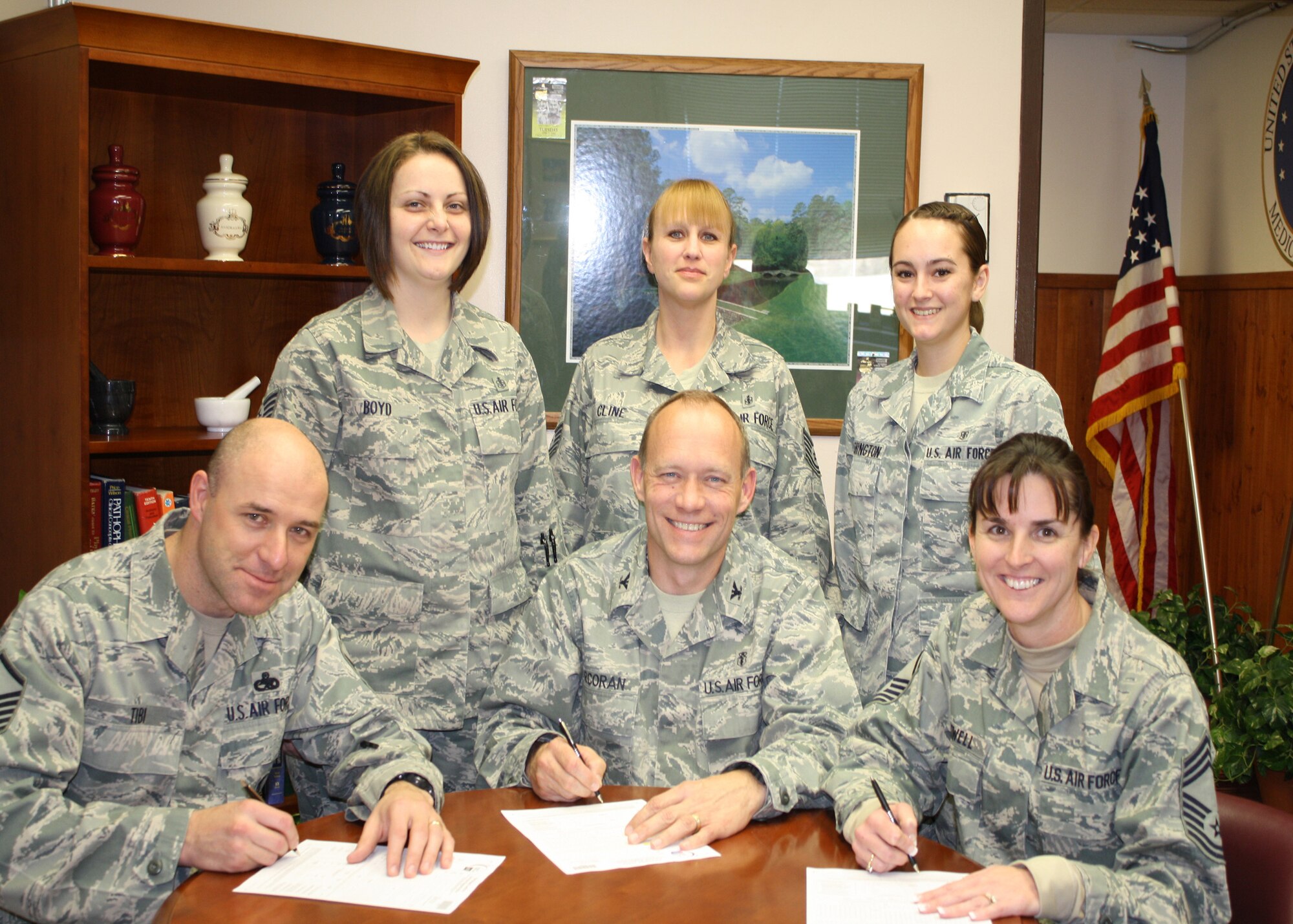 The 27th Special Operations Medical Group leadership and Airmen register for the 16th Annual Relay for Life, May 6-7 at Ned Houk Park near Clovis, N.M. Registering are: (standing, left to right) Staff Sgt. Lacy Boyd, 27th Special Operations Medical Operations Squadron; Tech. Sgt. Sherry Cline 27th Special Operations Medical Support Squadron; Airman Jessica Washington 27th Special Operations Aero Medical Squadron; (seated, left to right) Master Sgt.  Robert Tibi, 27 SOMDG first sergeant; Col. Scott Corcoran, 27 SOMDG commander; and Chief Master Sgt. Stephanie Powell, 27 SOMDG superintendant. (Courtesy photo)