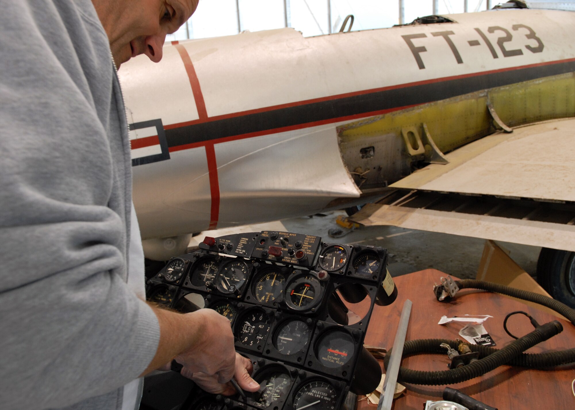 After scouring the internet for parts, Pete Nowicki installs some of the final pieces to complete a Navy A3D-1 Skywarrior control panel. (Air Force photo by Kate Blais)
