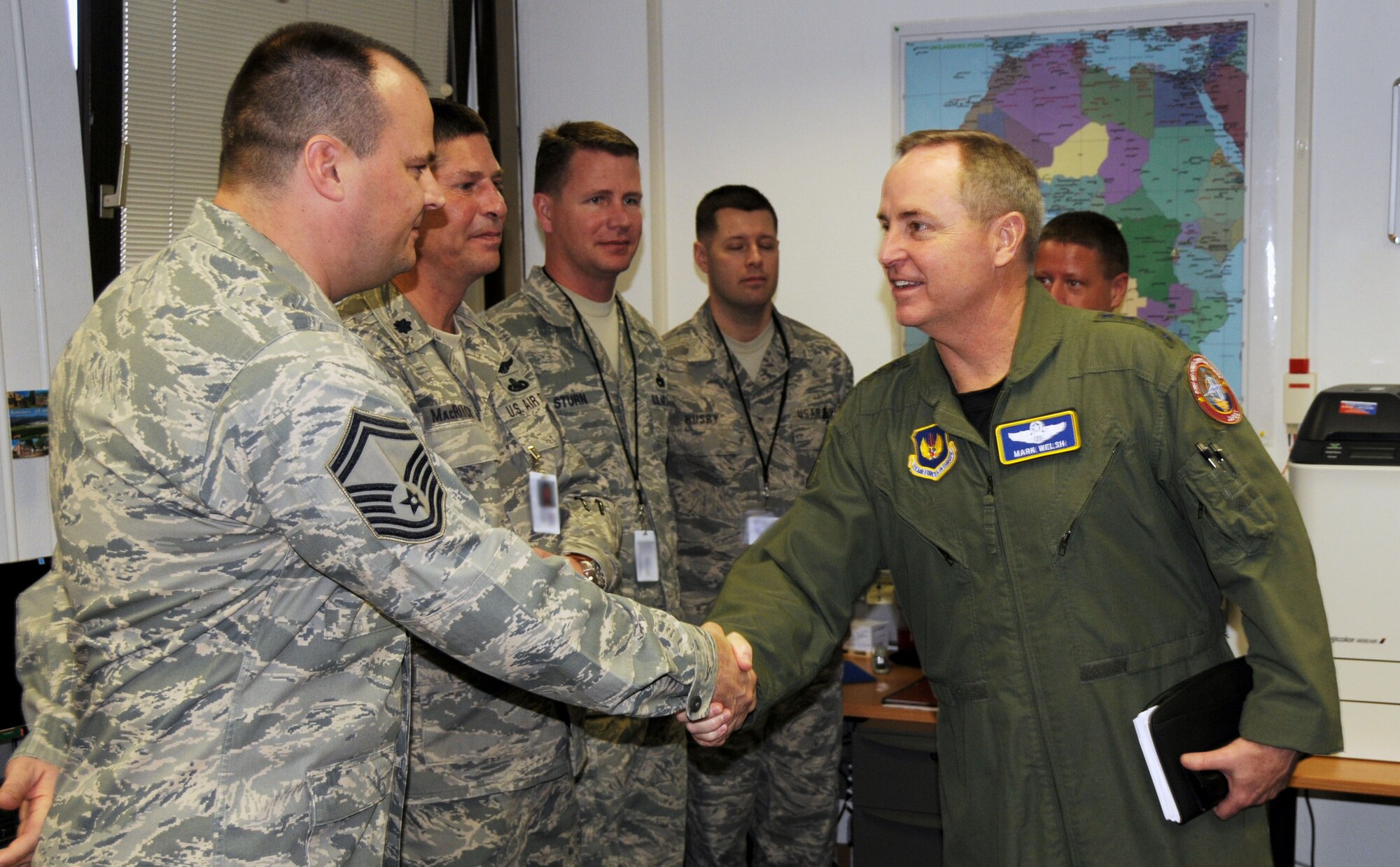 RAMSTEIN AIR BASE, Germany - Gen. Mark A. Welsh III (right), U.S. Air Forces in
Europe commander, shakes hands with Senior Master Sgt. Scott Jessen, 17th
Air Force (Air Forces Africa) Air Transportation manager, during a visit to
17th Headquarters Feb. 14. This was the General's first visit to 17th since
he assumed command of USAFE Dec. 13. The series of meetings and tour were
designed to acquaint him with 17th's mission of partnering with African
nations and building capacity. (U.S. Air Force photo illustration by Master Sgt. Jim
Fisher)
