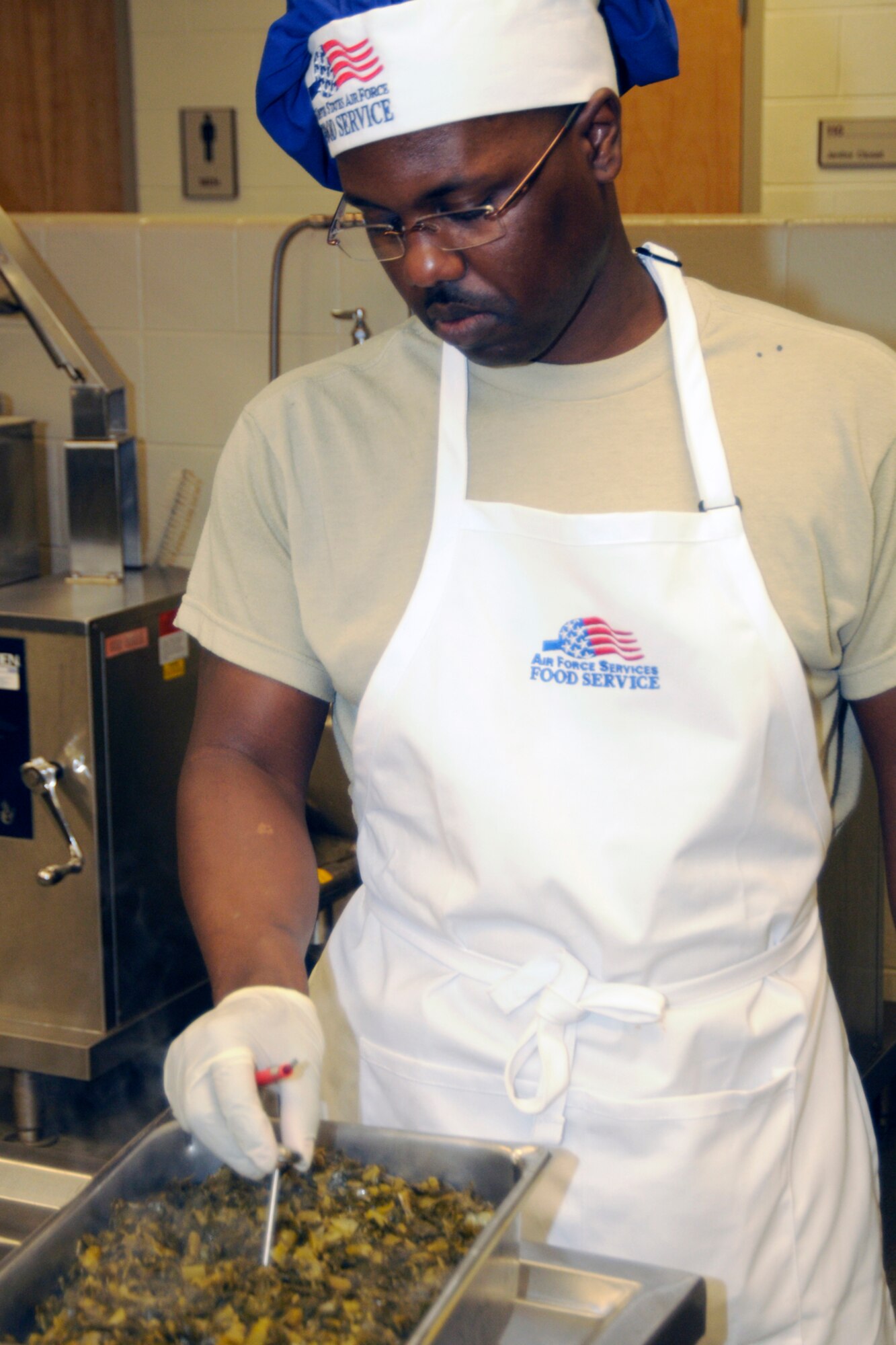 Technical Sgt. Milton Rogers helps prepare a meal during the February UTA of the 127th Wing at Selfridge Air National Guard Base, Mich., Feb. 12, 2011. The Wing’s food services unit, part of the 127th Force Support Squadron, was being evaluated for an Air National Guard award. As part of the evaluation Rogers was selected by the inspection team to attend a week of training at the Culinary Institute of America in California. (U.S. Air Force photo by TSgt. David Kujawa) (RELEASED)