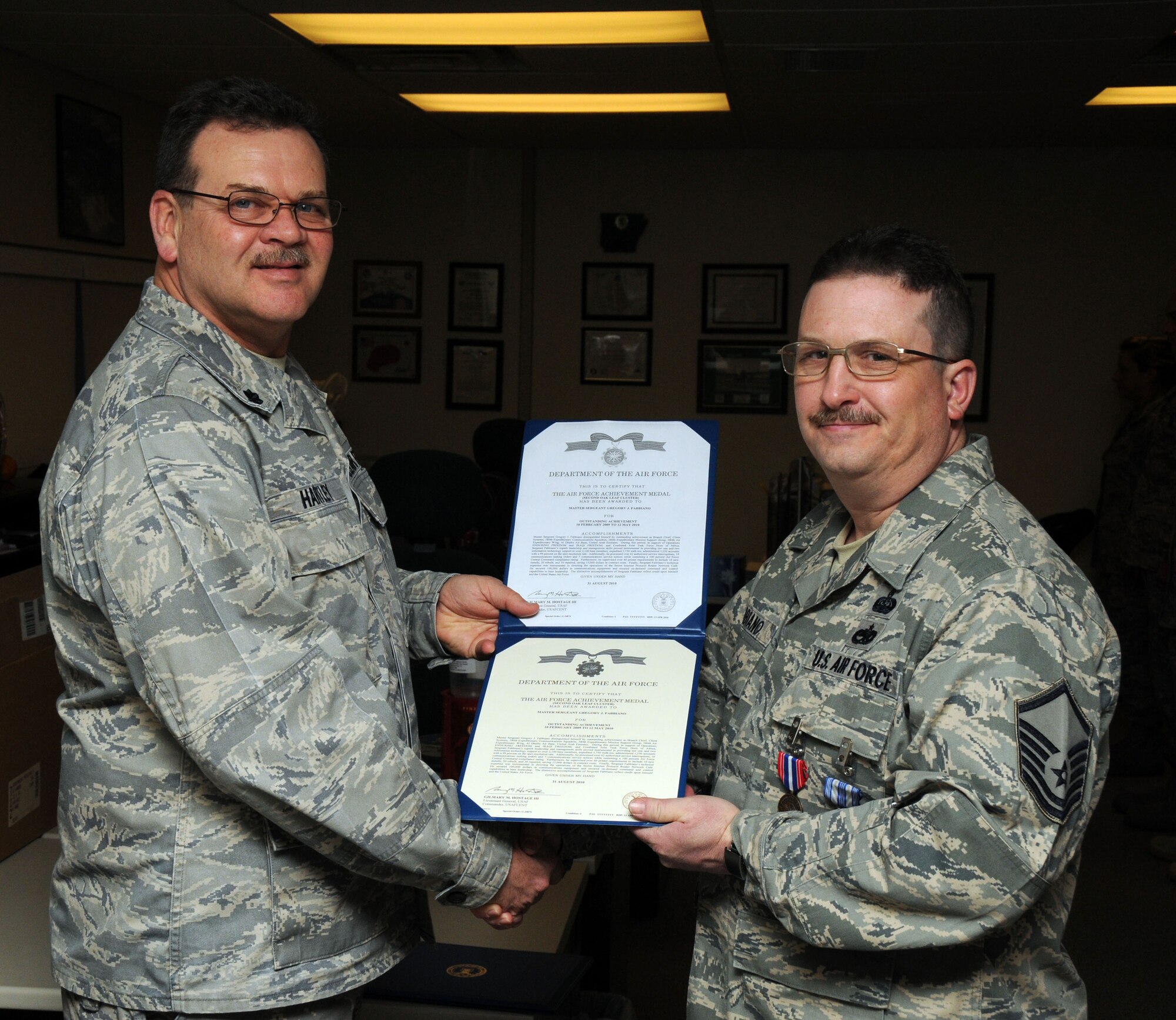 Master Sgt. Greg Fabbiano from the 107th AW Communications Flight was awarded both the Air Force Achievement Medal and the State of New York Medal for Merit for his dedication and outstanding work performance. . Lt. Col. Doug Hartley presented his the medals. (U.S. Air Force photo/Tech. Sgt. Justin Huett)