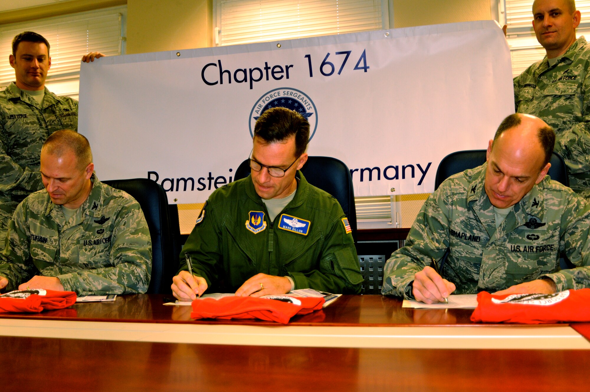 (From left) Col. Kip Turain, 521st Air Mobility Operations Wing commander; Brig. Gen. Mark Dillon, 86th Airlift Wing commander; and Col. John Shapland, 435th Air Ground Operations Wing commander, sign up for one year memberships with the Air Force Sergeants Association Feb. 9 in the 86th AW headquarters on Ramstein.  AFSA assists in drafting proposals for legislation on issues related to military members and their families. (U.S. Air Force photo by 2nd Lt. Lacie Collins)