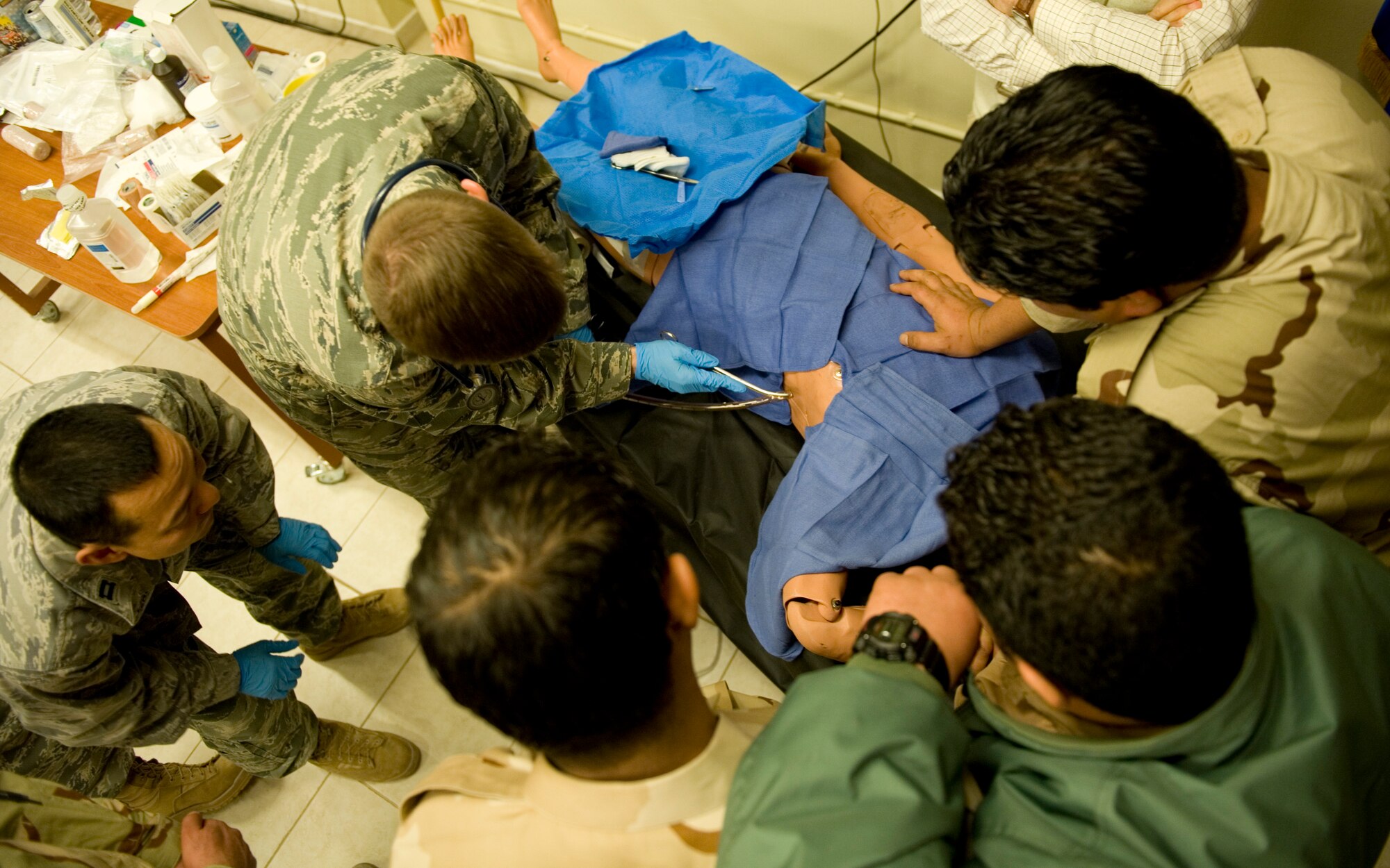 JOINT BASE BALAD, Iraq -- A U.S. Air Force family physician with the 332nd Expeditionary Medical Group teaches Iraqi medics how to apply a chest tube for draining fluids Feb. 8. The training was part of a first responder workshop held for Iraqi medics to help develop skills to treat trauma patients. (U.S. Air Force photo by Staff Sgt. Levi Riendeau)
