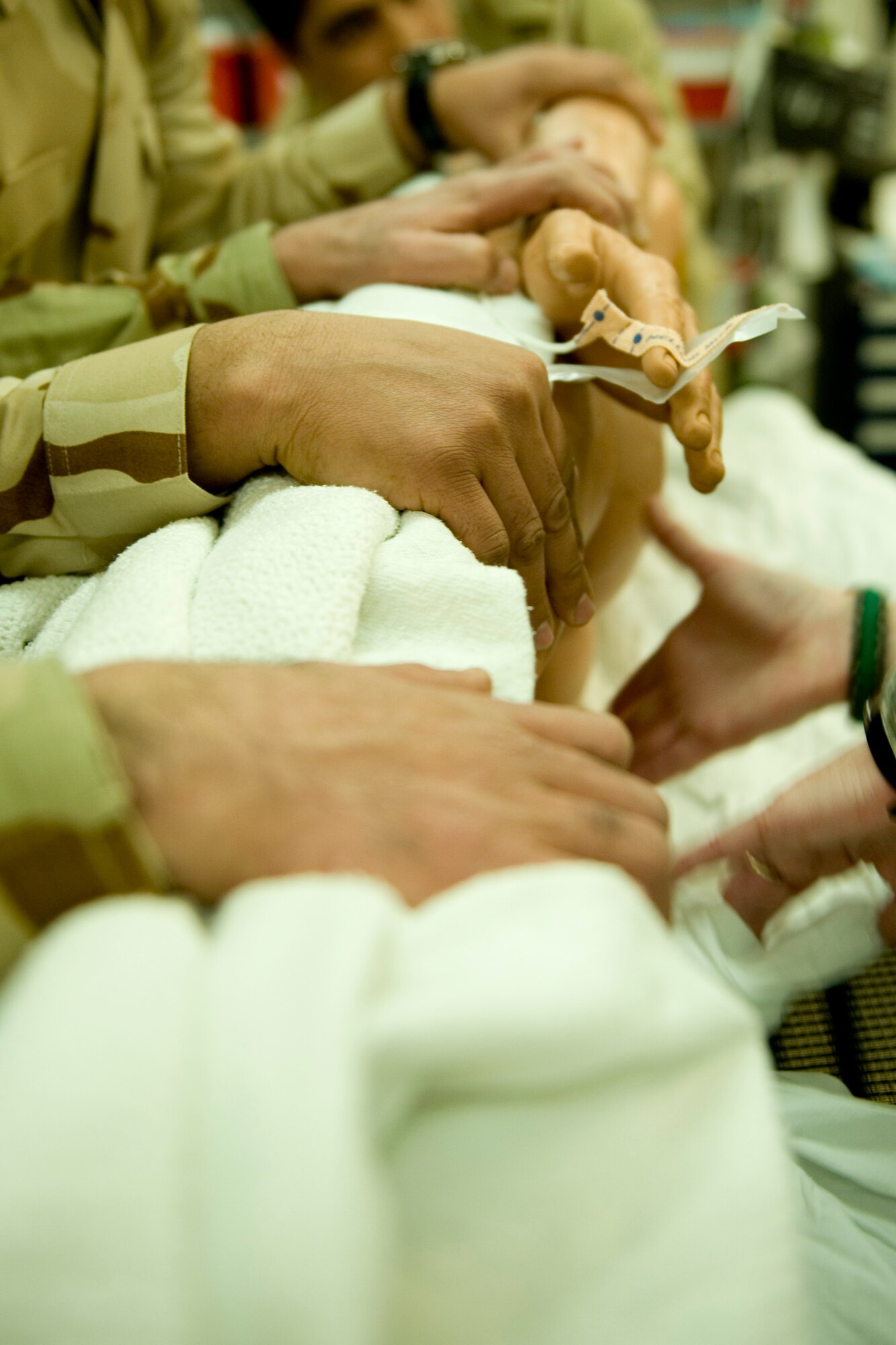 JOINT BASE BALAD, Iraq -- Iraqi medics conduct an initial assessment of a 'patient' that just arrived in the emergency room during training conducted by the 332nd Expeditionary Medical Group Feb. 8. The training was part of a first responder workshop held for Iraqi medics to help develop skills to treat trauma patients. (U.S. Air Force photo by Staff Sgt. Levi Riendeau)