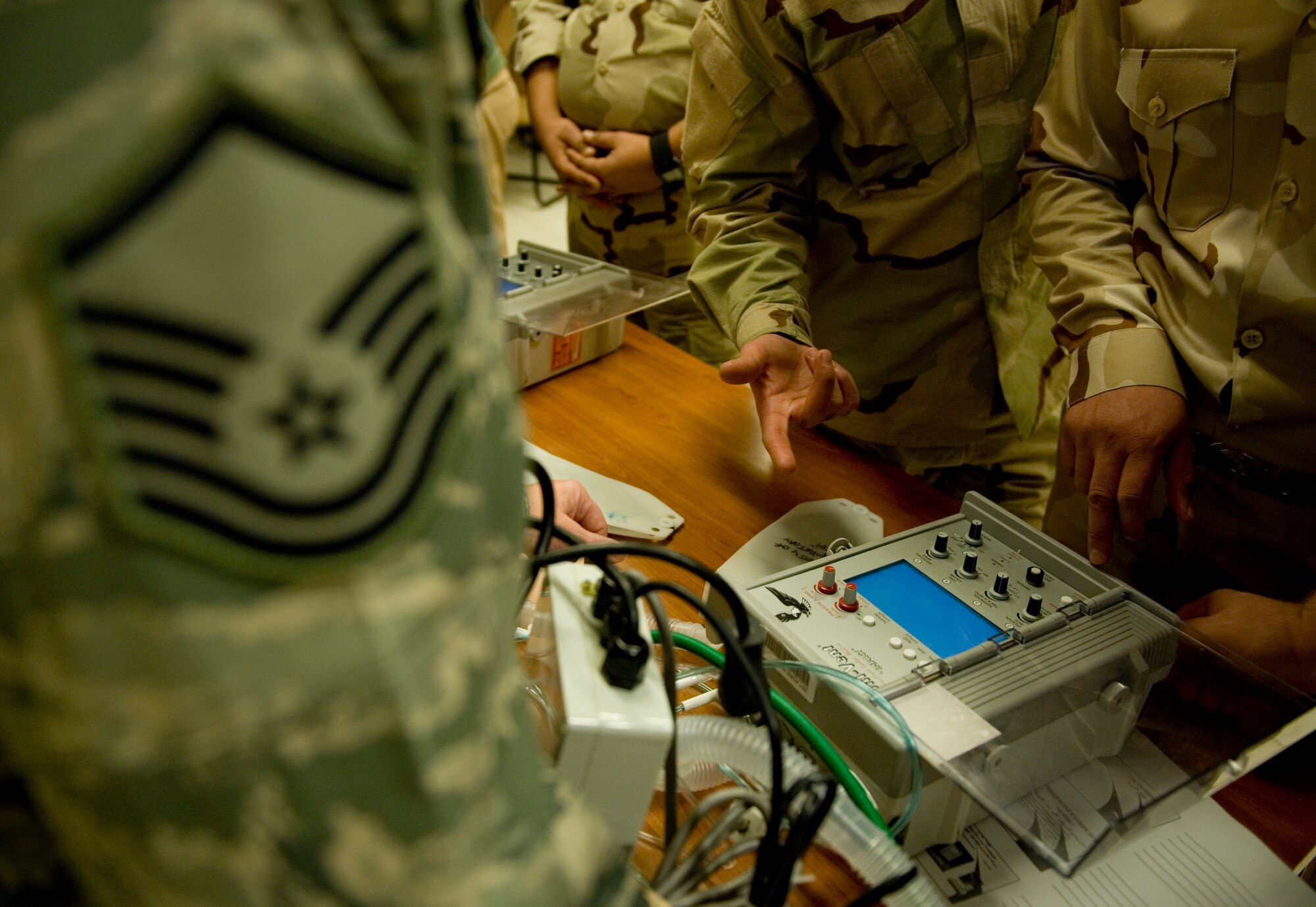 JOINT BASE BALAD, Iraq -- A 332nd Expeditionary Medical Operations Squadron airway management technician trains Iraqi medics on a transport ventilator Feb. 8. The training was part of a first responder workshop held for Iraqi medics to help develop skills to treat trauma patients. (U.S. Air Force photo by Staff Sgt. Levi Riendeau)