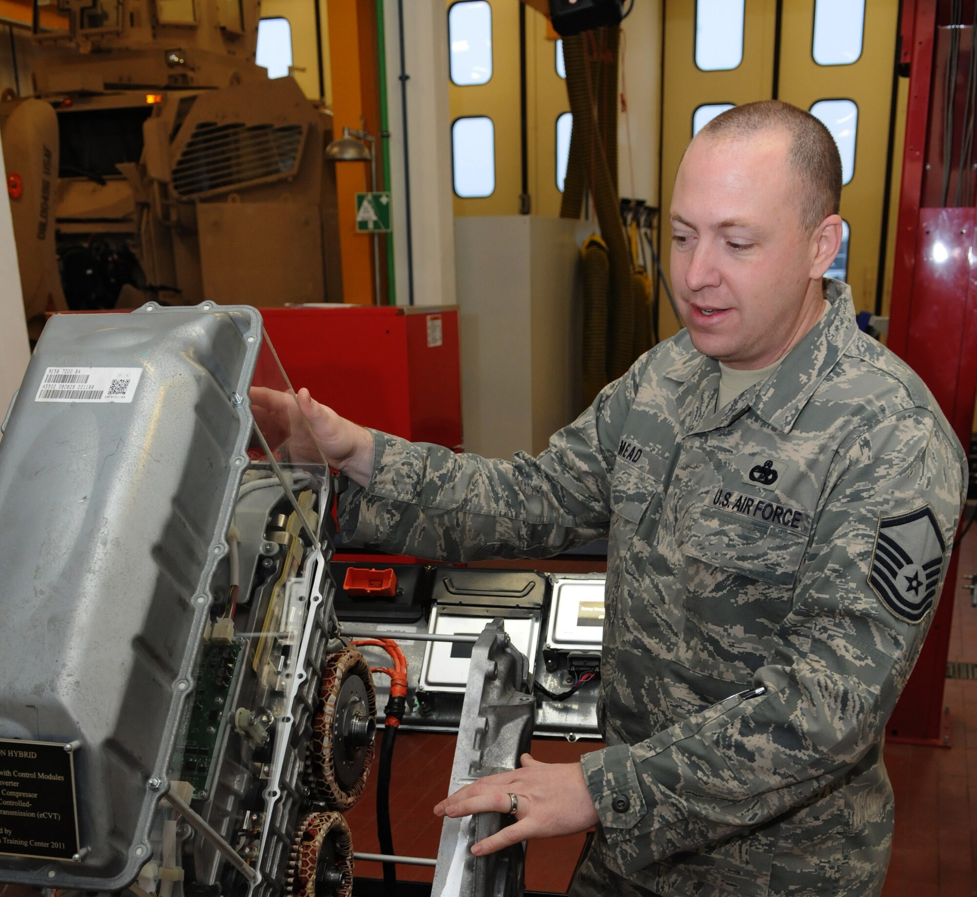 SPANGDAHLEM AIR BASE, Germany – Master Sgt. Kevin Mead, European Transportation Training Center instructor, talks about the training unit for hybrid vehicles made by the ETTC for training Airmen from U.S. Air Forces in Europe Feb. 3. Spangdahlem AB is scheduled to hold its first Introduction to Hybrids course in the ETTC in March to certify USAFE mechanics to work on hybrid vehicles. (U.S. Air Force photo/Airman 1st Class Matthew Fredericks)