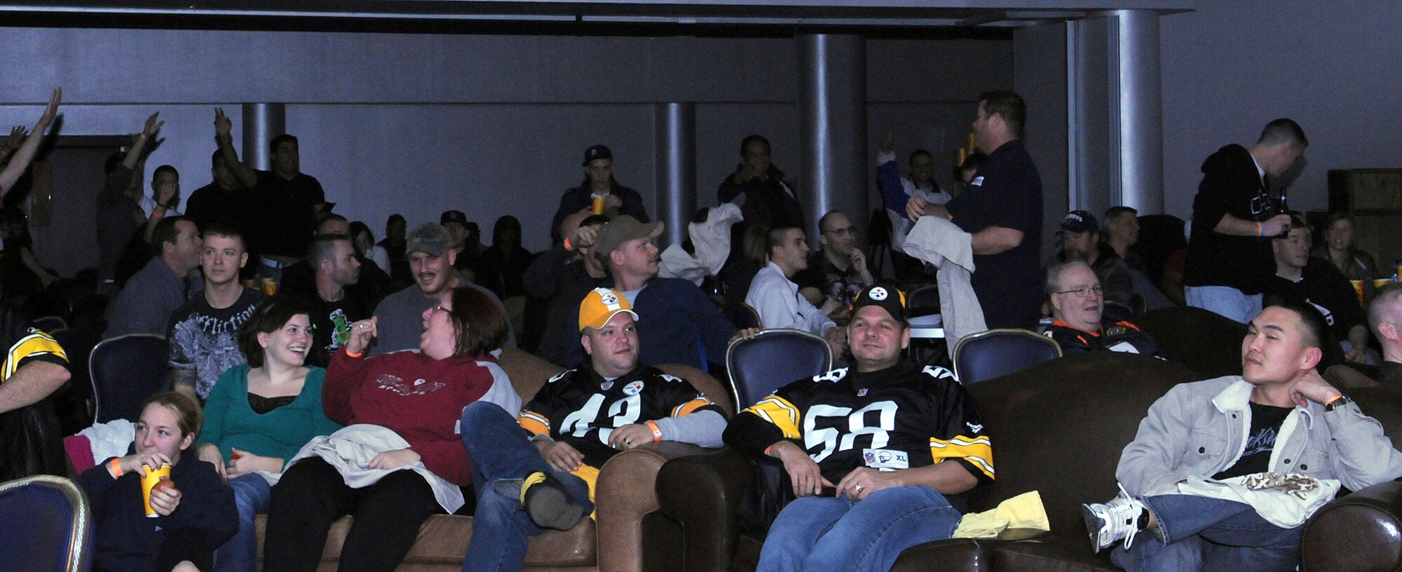 Incirlik Airmen watch the Green Bay Packers play the Pittsburgh Steelers at the Super Bowl XLV screening event at the consolidated club, Feb. 6-7, 2011, at Incirlik Air Base, Turkey. The event allowed Airmen to see the live broadcast of the game and, according to 39th Force Support Squadron officials, get a taste of home. The event was also the finale of the Incirlik Super Bowl commercial contest. Attendees had the opportunity to view and vote for their favorite locally-produced commercial. The first place winner received $10,000 in quality-of-life funds for the unit. (U.S. Air Force photo by Master Sgt. James Law/Released)