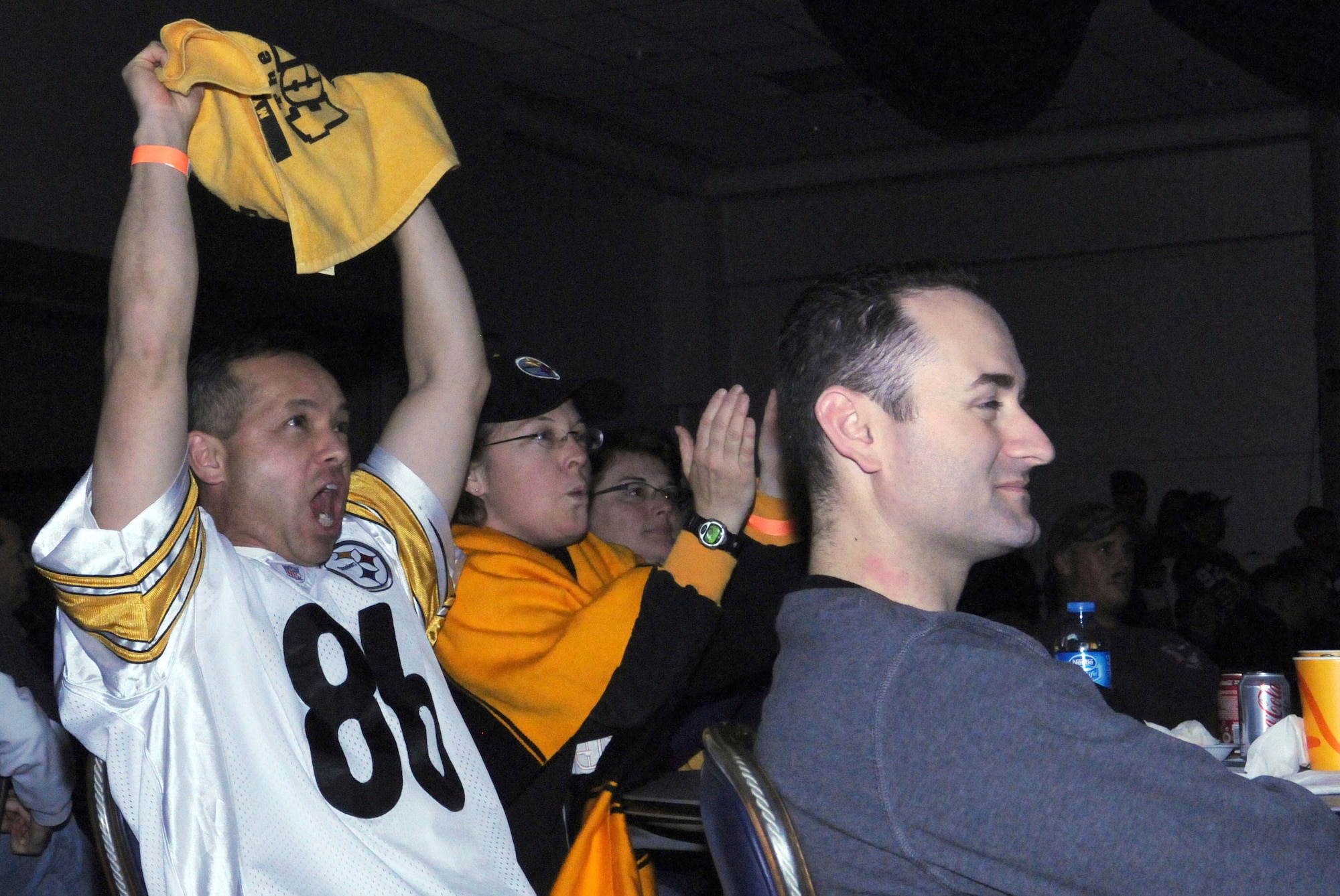 Lt. Col. Tonney Kaw-uh and his wife, Teresa, cheer for the Pittsburgh Steelers at the Super Bowl XLV screening event at the consolidated club, Feb. 6-7, 2011, at Incirlik Air Base, Turkey. The event allowed Airmen to see the live broadcast of the game and get a taste of home said 39th Force Support Squadron officials. The event was also the finale of the Incirlik Super Bowl commercial contest. Attendees had the opportunity to view and vote for their favorite locally-produced commercial. The first place winner received $10,000 in quality-of-life funds for the unit. Lt Col Kaw-Uh is the 39th Air Base Wing inspector general. (U.S. Air Force photo by 1st Lt. Gina M. McKeen/Released)