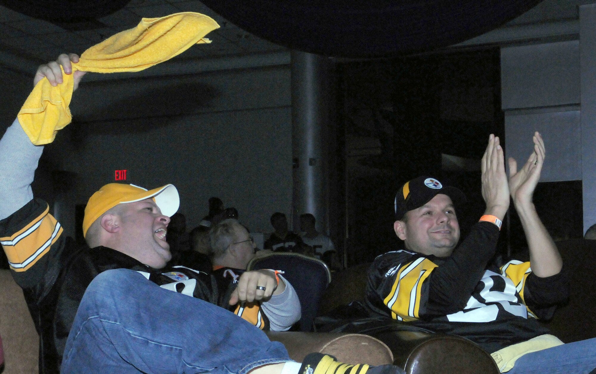 Two Incirlik Airmen cheer for their team at the Super Bowl XLV screening event at the consolidated club, Feb. 6-7, 2011, at Incirlik Air Base, Turkey. The event allowed Airmen to see the live broadcast of the game and get a taste of home, said 39th Force Support Squadron officials. The event was also the finale of the Incirlik Super Bowl commercial contest. Attendees had the opportunity to view and vote for their favorite locally-produced commercial. The first place winner received $10,000 in quality-of-life funds for the unit. (U.S. Air Force photo by 1st Lt. Gina M. McKeen/Released)