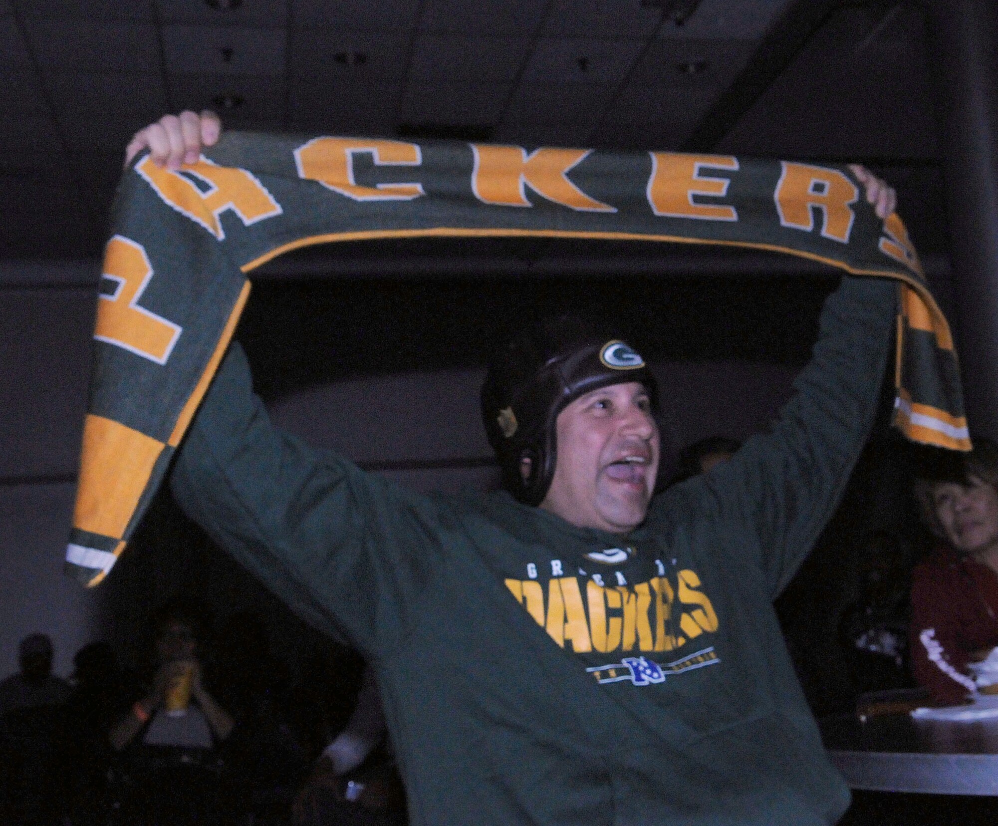 110206-F-6415M-026
A Green Bay Packers fan cheers for his team at the Super Bowl XLV screening event at the consolidated club, Feb. 6-7, 2011, at Incirlik Air Base, Turkey. The event allowed Airmen to see the live broadcast of the game and get a taste of home, said 39th Force Support Squadron officials. The event was also the finale of the Incirlik Super Bowl commercial contest. Attendees had the opportunity to view and vote for their favorite locally-produced commercial. The first place winner received $10,000 in quality-of-life funds for the unit. (U.S. Air Force photo by 1st Lt. Gina McKeen/Released)
