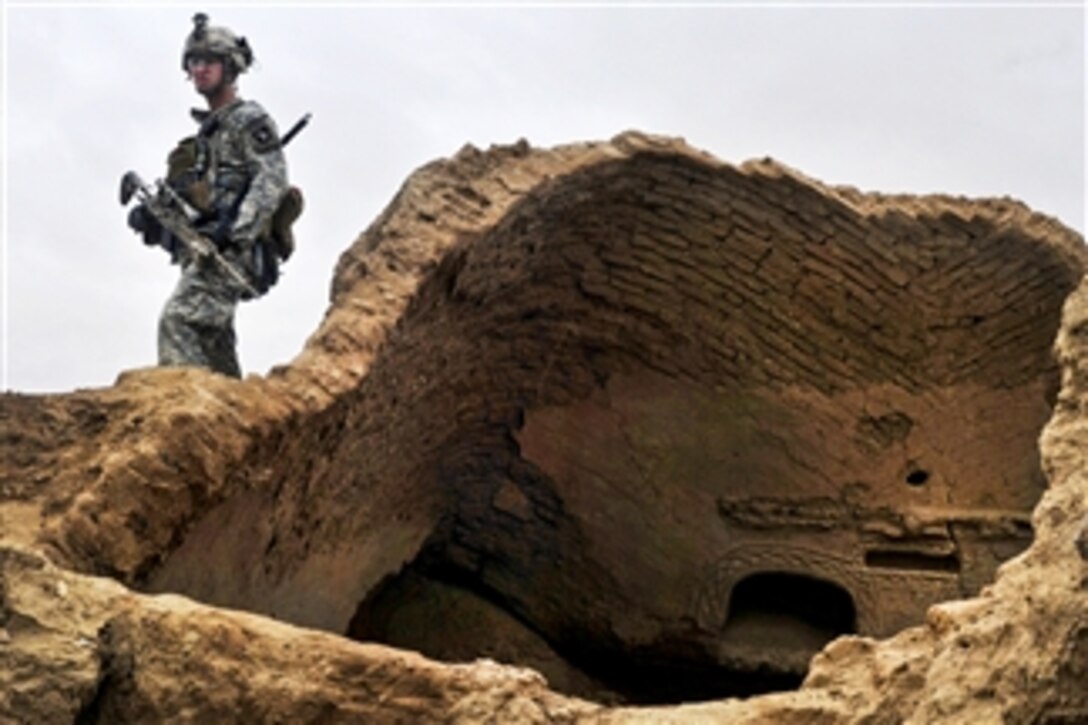 U.S. Army Sgt. David Smitt maintains over watch during an air assault patrol with U.S. soldiers and British gunners in Afghanistan's Kandahar province on Feb. 10, 2011.  Smitt is assigned to 101st Combat Aviation Brigade and the gunners are assigned to the Royal Air Force Regiment's 15th Squadron.  