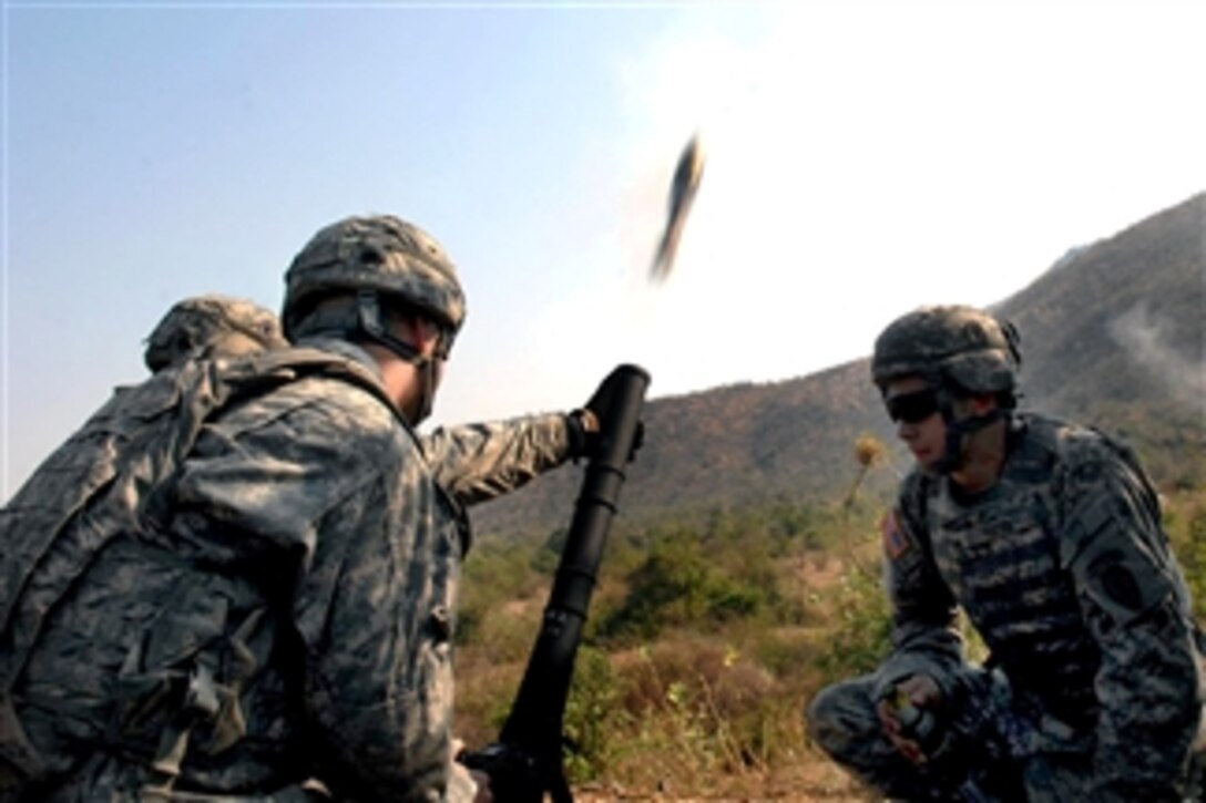 U.S. Army soldiers fire a 60 mm mortar round during Cobra Gold on Pulon Range, Thailand, on Feb. 11, 2011.  Cobra Gold is a joint forces, multinational exercise designed to ensure regional peace and stability.  