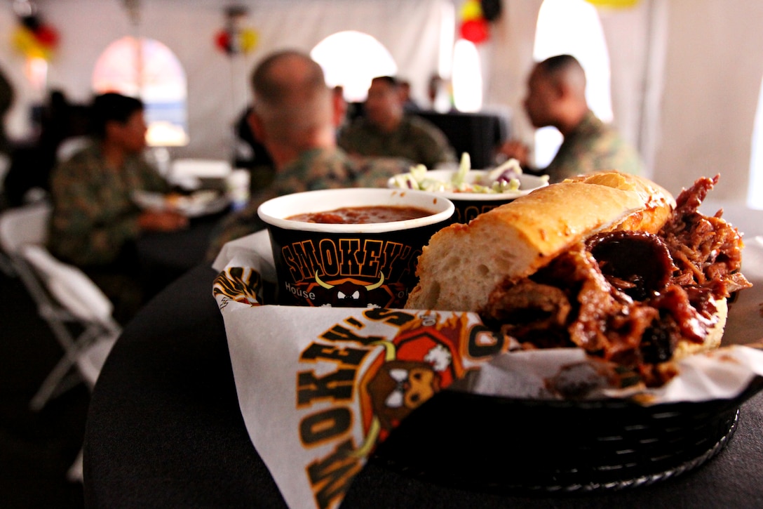 Smokey’s House of BBQ has been available for Camp Pendleton residents since Jan. 6; however, their official grand-opening took place, Feb. 17. During the grand opening, free food was provided to distinguished guests including Sgt. Maj. Ramona D. Cook, Marine Corps Base Camp Pendleton sergeant major; Col. James A. Hogberg, commanding officer, Headquarters and Support Battalion, MCB Camp Pendleton; Sgt. Maj. James E. Smith Jr., HQSPT Battalion sergeant major, MCB Camp Pendleton; and Master Gunnery Sgt. Francisco Olmos, deputy director, Marine Corps Community Services business and operations. Free food was also provided to customers that showed up between 12:30 and 1:30 p.m. The new restaurant is located in the parking lot of the base’s bowling alley and offers numerous entrees such as baby-back ribs, pulled-pork sandwiches and several chicken platters. For more information about Smokey’s menu, contact Allen Kurland, owner of Smokey’s, at 949-636-6386.