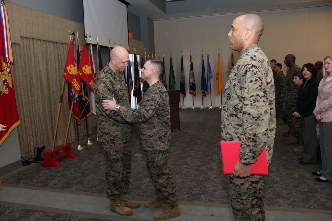 Lt. Col. Ryan G. Goulette, commanding officer of Marine Aviation Logistics Squadron 14, bids farewell to Sgt. Maj. William S. Harvey at Miller’s Landing during a ceremony in which Harvey relinquished his position as squadron sergeant major Feb. 17. Harvey believes that the position of sergeant major sets the commanding officer up to maximize his ability to command.