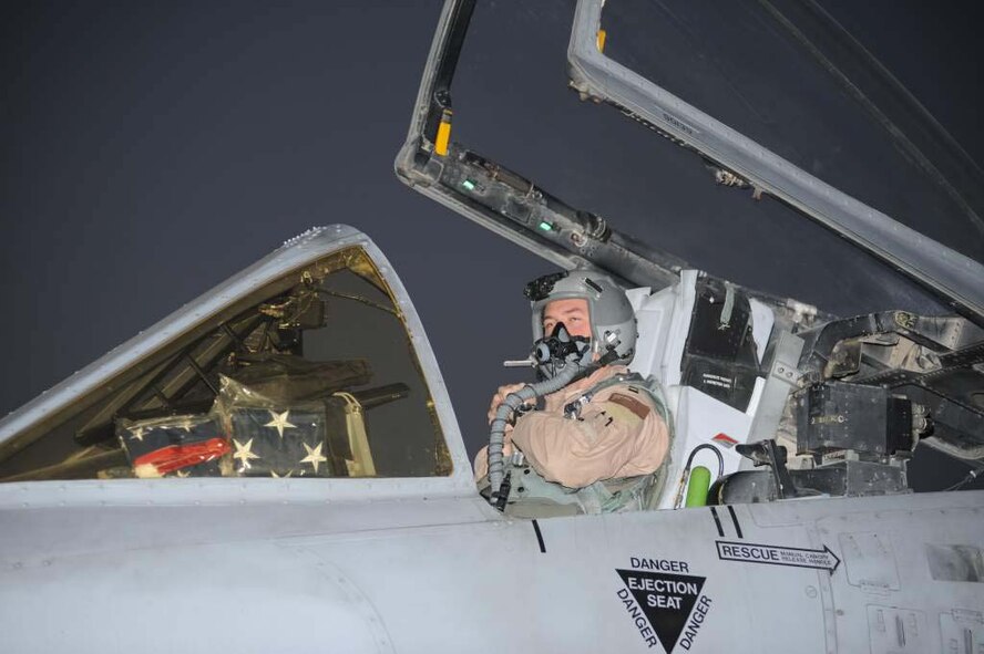 75th Expeditionary Fighter Squadron A-10 pilot Capt. Ryan Hayde prepares to fly a mission over Afghanistan accompanied by American flags. Flags from all countries, sports teams, schools and more may be flown as part of the 451st AEW flag flying program at Kandahar Airfield, but American flags are by far the most common requested. The program is free, but the requester must supply his or her own flag. (U.S. Air Force photo/ Tech. Sgt. Chad Chisholm)