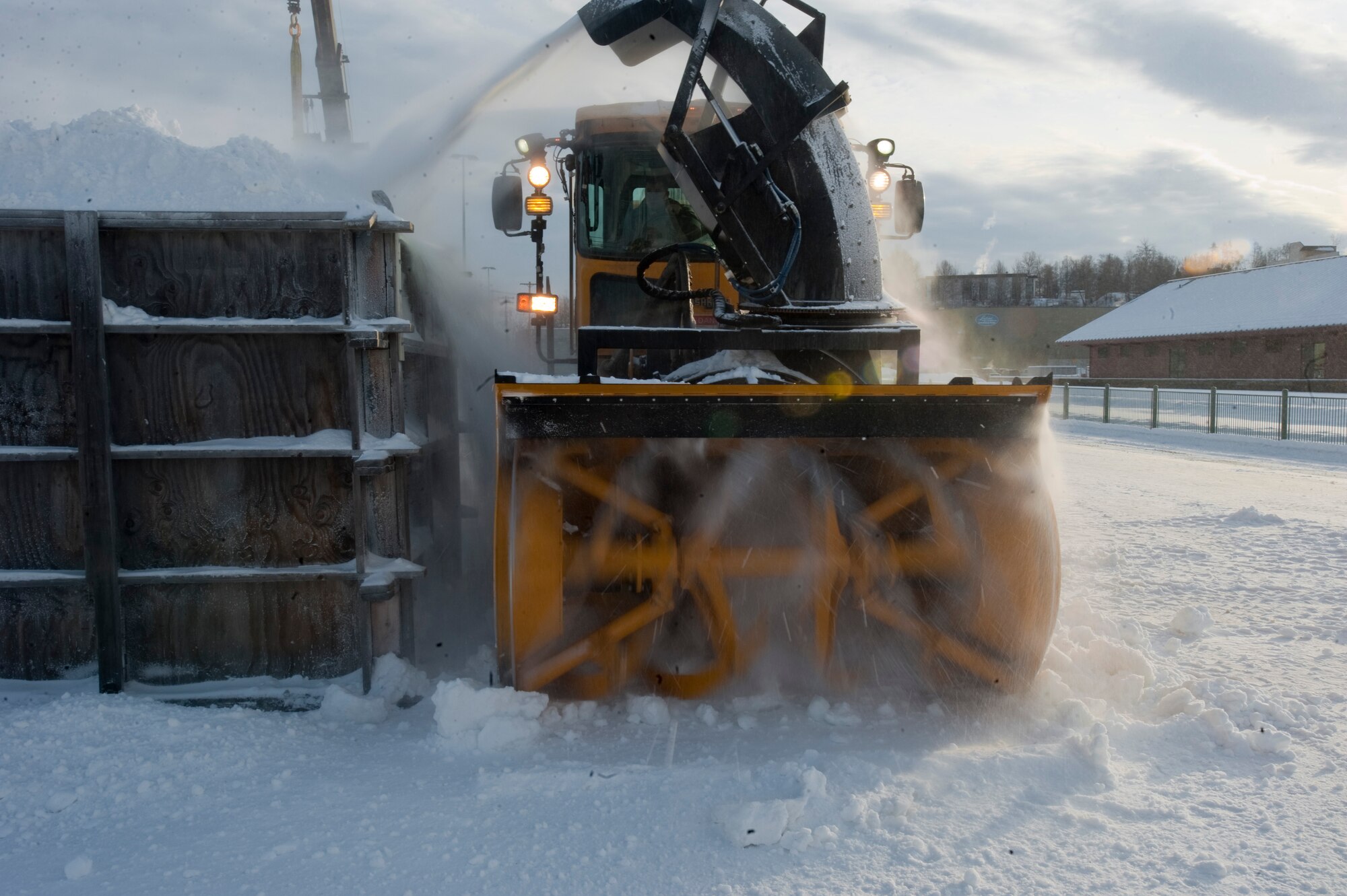 ANCHORAGE, Alaska -- A snow blower blows snow into a box Feb. 17, members of the 773rd Civil Engineer Group from Joint Base Elmendorf-Richardson spent the day in Anchorage forming snow blocks that will be used for the ice sculpture competition during this year's Fur Rendezvous Festival. Fur Rondy is an annual winter festival held in Anchorage dating to the mid-1930s. This year's Fur Rondy will be from Feb. 25 through March 6. (Air Force photo by Airman 1st Class Christopher Gross)