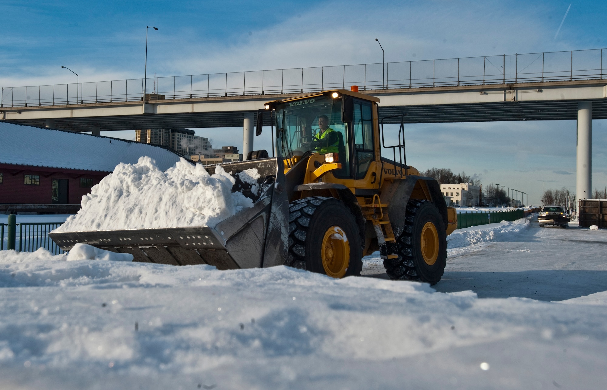 ANCHORAGE, Alaska -- Airman 1st Class Dustin Chidsey, 773rd Civil Engineer Group from Joint Base Elmendorf-Richardson, hauls a load of snow Feb. 17. Several members of the 773rd CEG spent the day in Anchorage forming snow blocks that will be used for the ice sculpture competition during this year's Fur Rendezvous Festival. Fur Rondy is an annual winter festival held in Anchorage dating to the mid-1930s. This year's Fur Rondy will be from Feb. 25 through March 6. (Air Force photo by Airman 1st Class Christopher Gross)