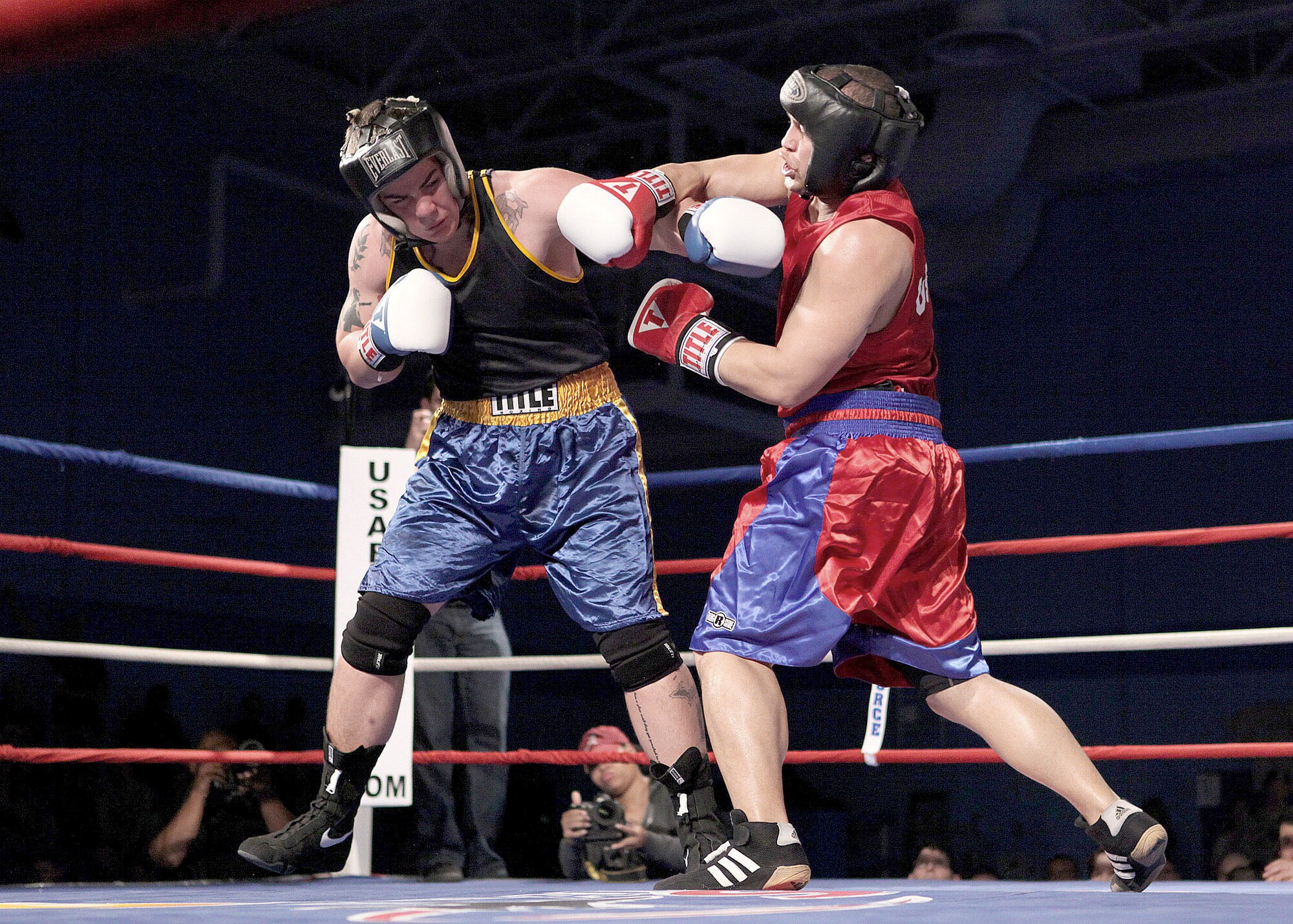Senior Airman Kent Brinson (right) defeated Navy Information Technician Sean Hedgeman 28-5, during their Armed Forces Boxing Championships bout Feb. 15 , 2011, at Lackland Air Force Base, Texas. (U.S. Air Force photo/Robbin Cresswell)