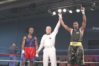 U.S. Army Spc. Zacchaeus Hardrick, Fort Carson, Colo., defeats Air National Guardsman Gary Griffin, Stewart ANG, N.Y., Feb. 15 during their Armed Forces Boxing Championships bout at Lackland Air Force Base, Texas. (U.S. Air Force photo/Robbin Cresswell)