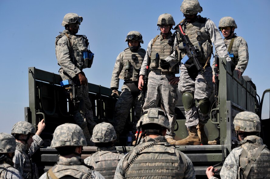 AVON PARK, Fla. -- The 823rd Base Defense Squadron goes over their plan of attack one last time before their first assault into the village during joint exercise ATLANTIC STRIKE 11-01 Feb. 15. Their mission was to support the joint terminal attack controllers and make the exercise more realistic for the them. (U.S. Air Force photo/Airman 1st Class Nicholas Benroth)(RELEASED)