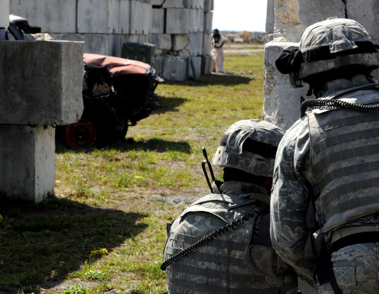 AVON PARK, Fla.-- Two Airmen from the 823rd Base Defense Squadron make contact with a member of the opposing forces unit during joint exercise ATLANTIC STRIKE 11-01 Feb. 16. The joint forces exercise lasted nearly two weeks in which the 823rd BDS worked with joint terminal attack controllers from different units and nations to make the exercise a success. (U.S. Air Force photo/Airman 1st Class Benjamin Wiseman)(RELEASED)