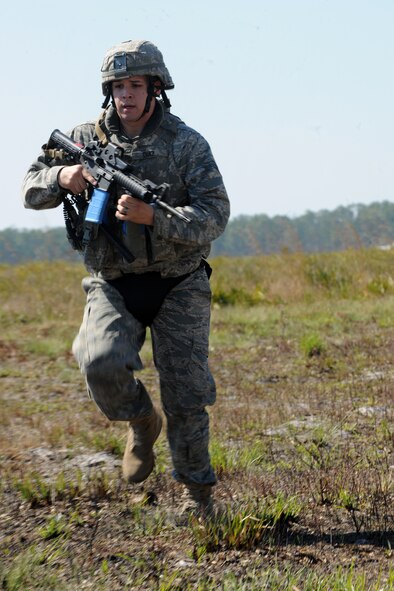 AVON PARK, Fla.-- Airman 1st Class Daniel Diaz, 823rd Base Defense Squadron fire team member, runs for cover during joint exercise ATLANTIC STRIKE 11-01 Feb. 15. The 823rd had to take control of the mock village during the joint exercise as they received resistance from opposing forces. (U.S. Air Force photo/Airman 1st Class Benjamin Wiseman)(RELEASED)