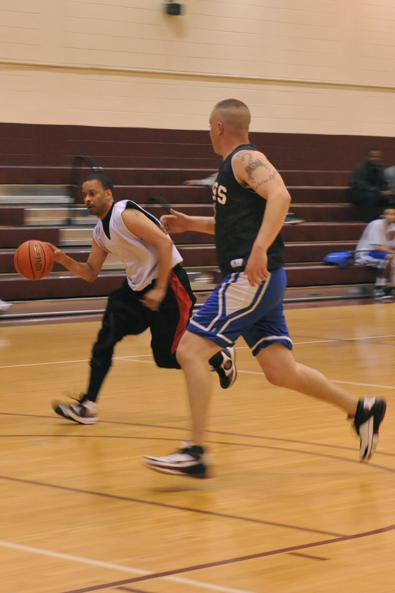 SEYMOUR JOHNSON AIR FORCE BASE, N.C. – Paul Shuford, protects the ball while running during a intramural basketball game here, Feb. 16. The 4th Force Support Squadron allows dependants to play on their spouse’s unit intramural team. Shuford, the husband of Tech.Sgt Danitra Shuford, is a native of Montgomery, Ala. (U.S. Air Force photo/Senior Airman Whitney Lambert) (RELEASED)