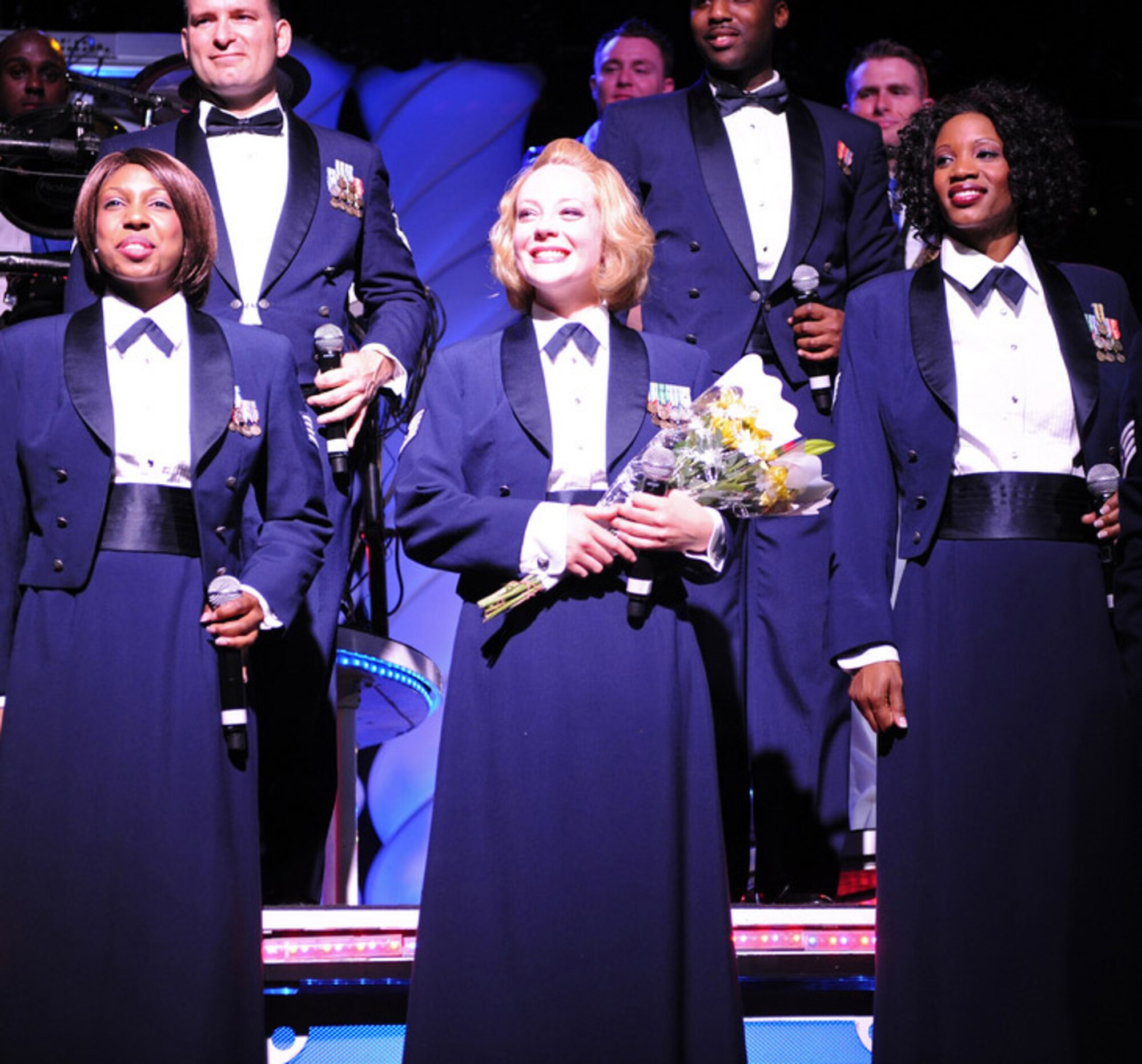 PRESIDIO OF MONTEREY, Calif.—Tech. Sgt Lesley Hunter, center, a Tops in Blue vocalist, and other members of the expeditionary entertainment group, performed at the Golden State Theater, in Monterey, Feb. 15. Sergeant Hunter is scheduled to return to her duties at the 314th Training Squadron in April. (Courtesy photo)