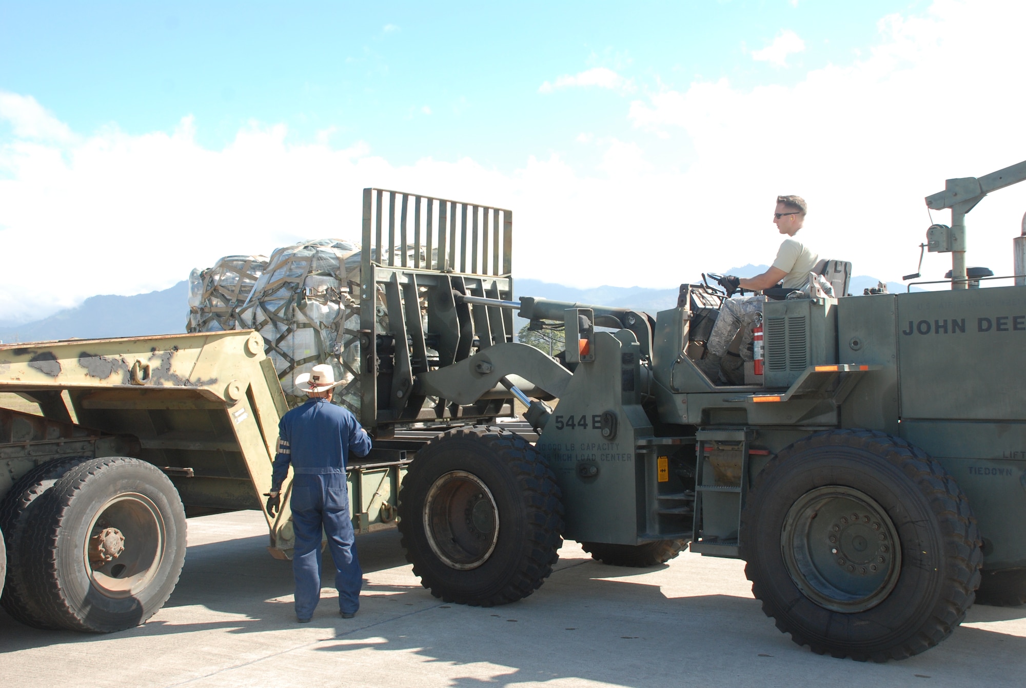 SOTO CANO AIR BASE, Honduras - Tech. Sgt. Zachary Brown, 612th Air Base Squadron Air Terminal Operation Center non-commissioned officer in charge, loads a pallet of donated items onto a flatbed truck here, Feb. 16.  The items were delivered by the 2nd Air Refueling Squadron from McGuire AFB, N.J.  The crew was on a training mission, and, under the DENTON Program, were able to use the cargo space on thier KC-10 air to air refueling tanker for the 42,000-pounds of goods.  The shipment will be turned over to Joint Task Force-Bravo Civil and Military Affairs for delivery to local charities.  JTF-Bravo contributes to regional stability and peace, which facilitates economic prosperity and growth.  (Air Force photo/Capt. John T. Stamm)