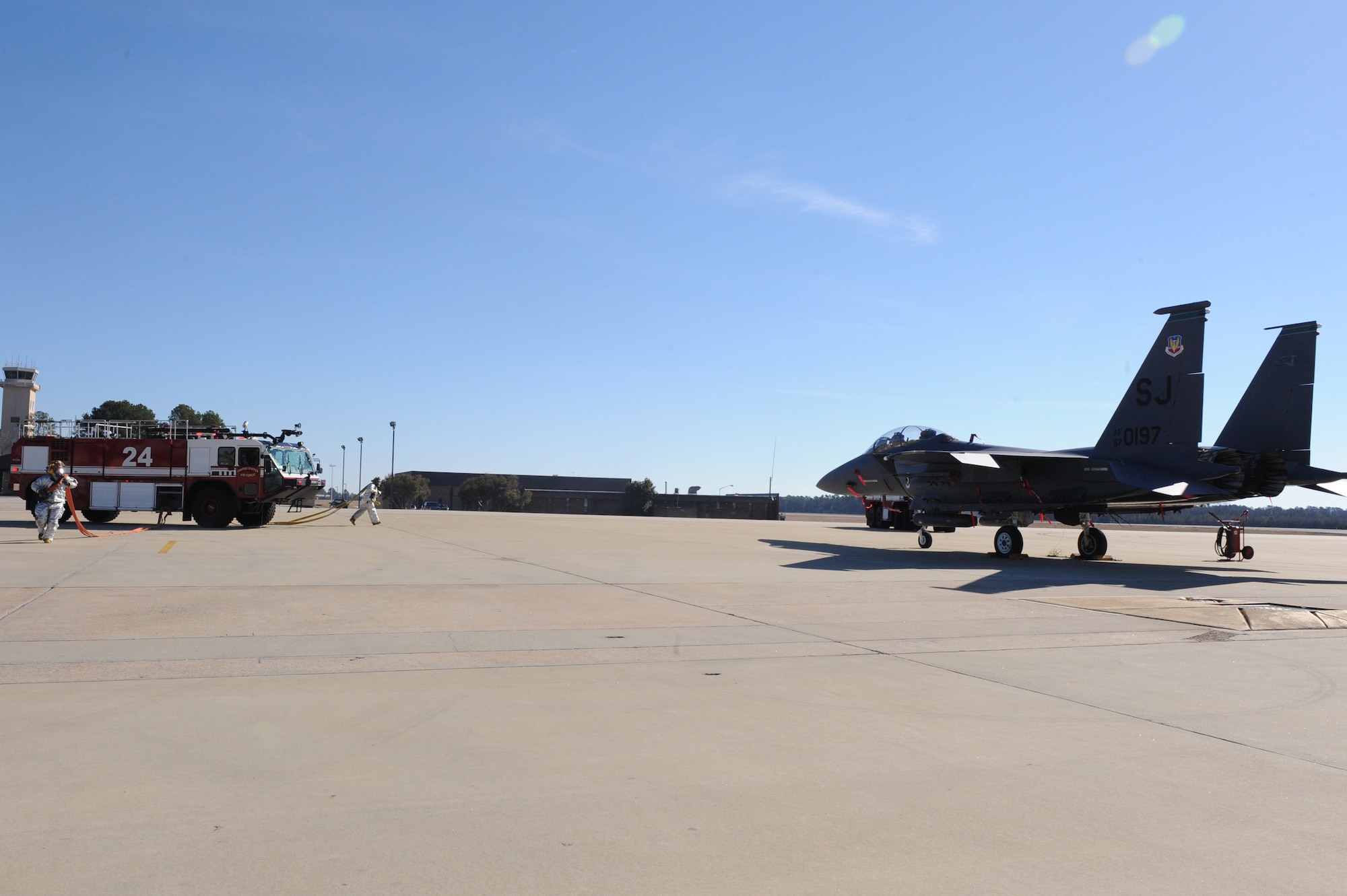 SEYMOUR JOHNSON AIR FORCE AIR FORCE BASE, N.C. -- Firefighters from the 4th Civil Engineer Squadron respond to a simulated aircraft fire with two incapacitated aircrew members during egress training here, Feb. 15, 2011. It is a base requirement for all fire fighters to complete egress training on the F-15E Strike Eagle and the KC-135R Stratotanker quarterly. (U.S. Air Force photo/Staff Sgt. Courtney Richardson) (RELEASED)
