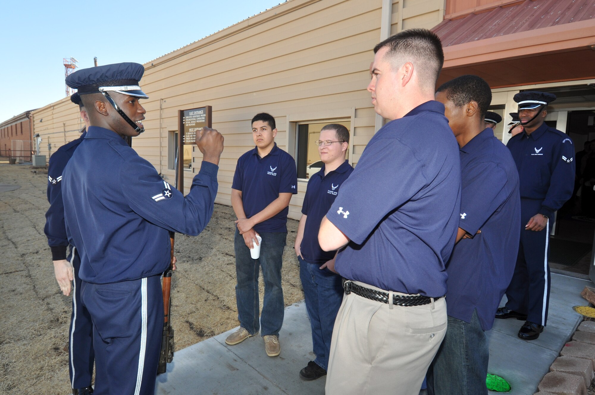 Air Force Drill Team member Airman 1st Class Billy Degraffenreid, at left, speaks with Senior Airman Chris Padilla, 552nd Maintenance Squadron, at right, and other members of the Tinker AFB Honor Guard on Wednesday. The drill team performed at the Tinker Exchange the afternoon of Feb. 16, left, and at the Oklahoma City Thunder’s military appriciation night Feb. 15. (Air Force photos by Dave Faytinger)
