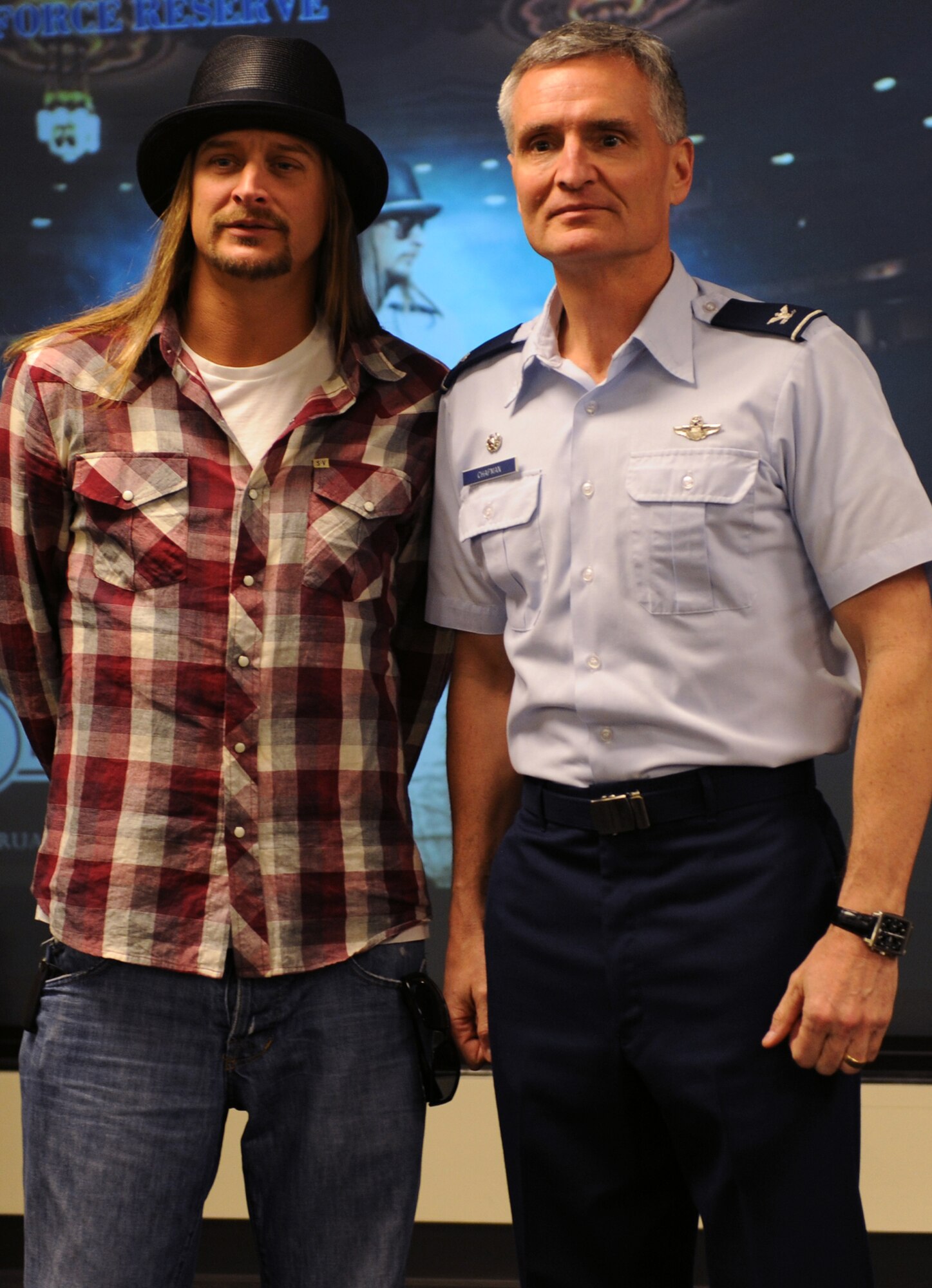 315th Airlift Wing Commander, Col. Steven Chapman posses for a photo with Kid Rock after presenting the performer with a 315 AW coin to thank him for his visit to show his support to the troops. (USAF Photo/Airman 1st Class Jodi Martinez)