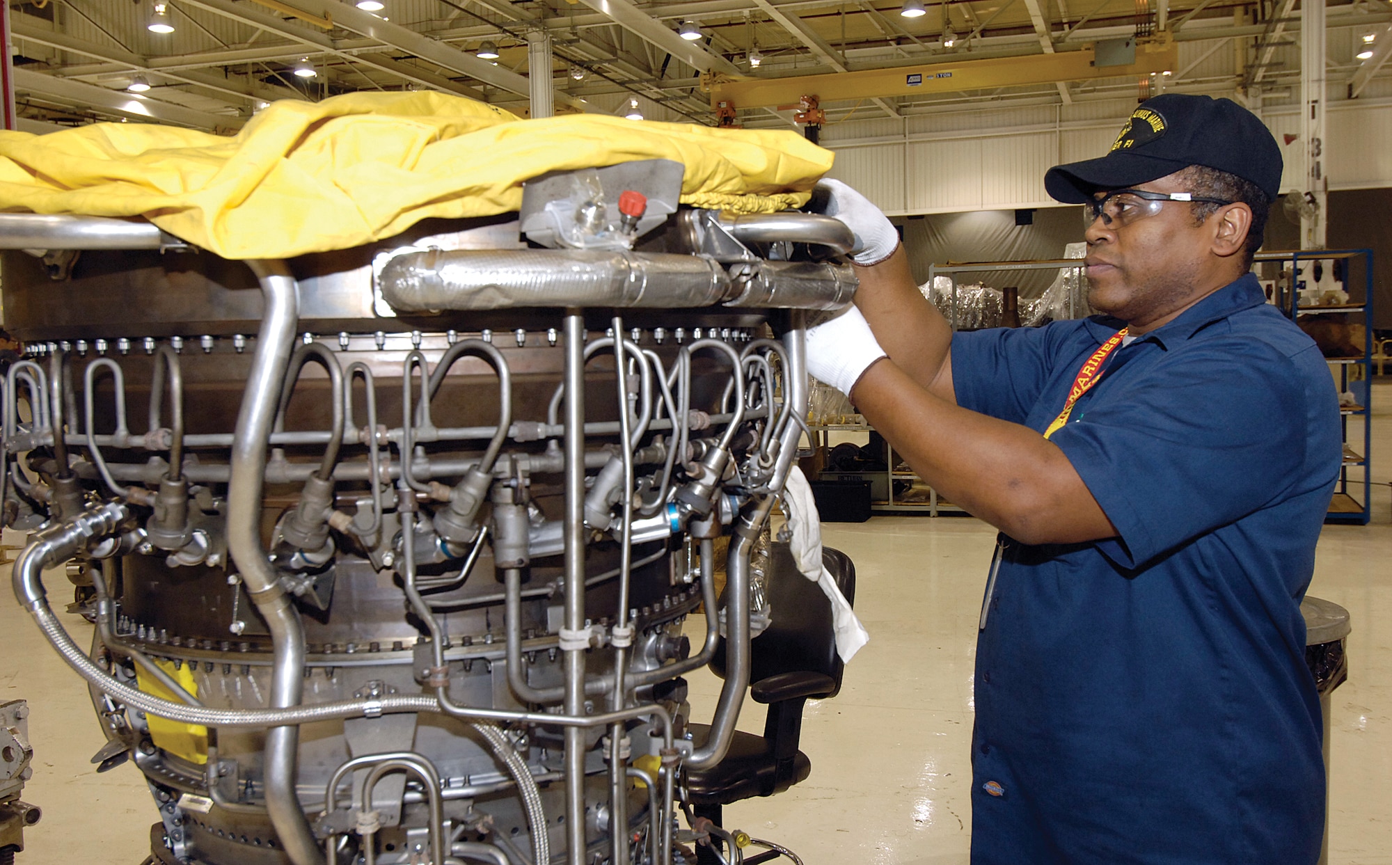 Jet engine mechanic James Nesbit assembles an F108 core in their new Bldg. 9001 area.  (Air Force photos by Margo Wright)