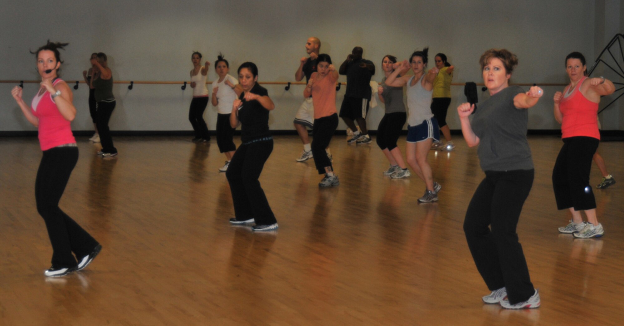 ROYAL AIR FORCE LAKENHEATH, England - Gina Burton, Lakenheath Fitness & Sports Center Fitness instructor, leads the Cardio Kickboxing class Feb. 16. The class is one of 26 the center holds each week for servicemembers and families to get in shape in a team environment. (U.S. Air Force photo/Senior Airman David Dobrydney)