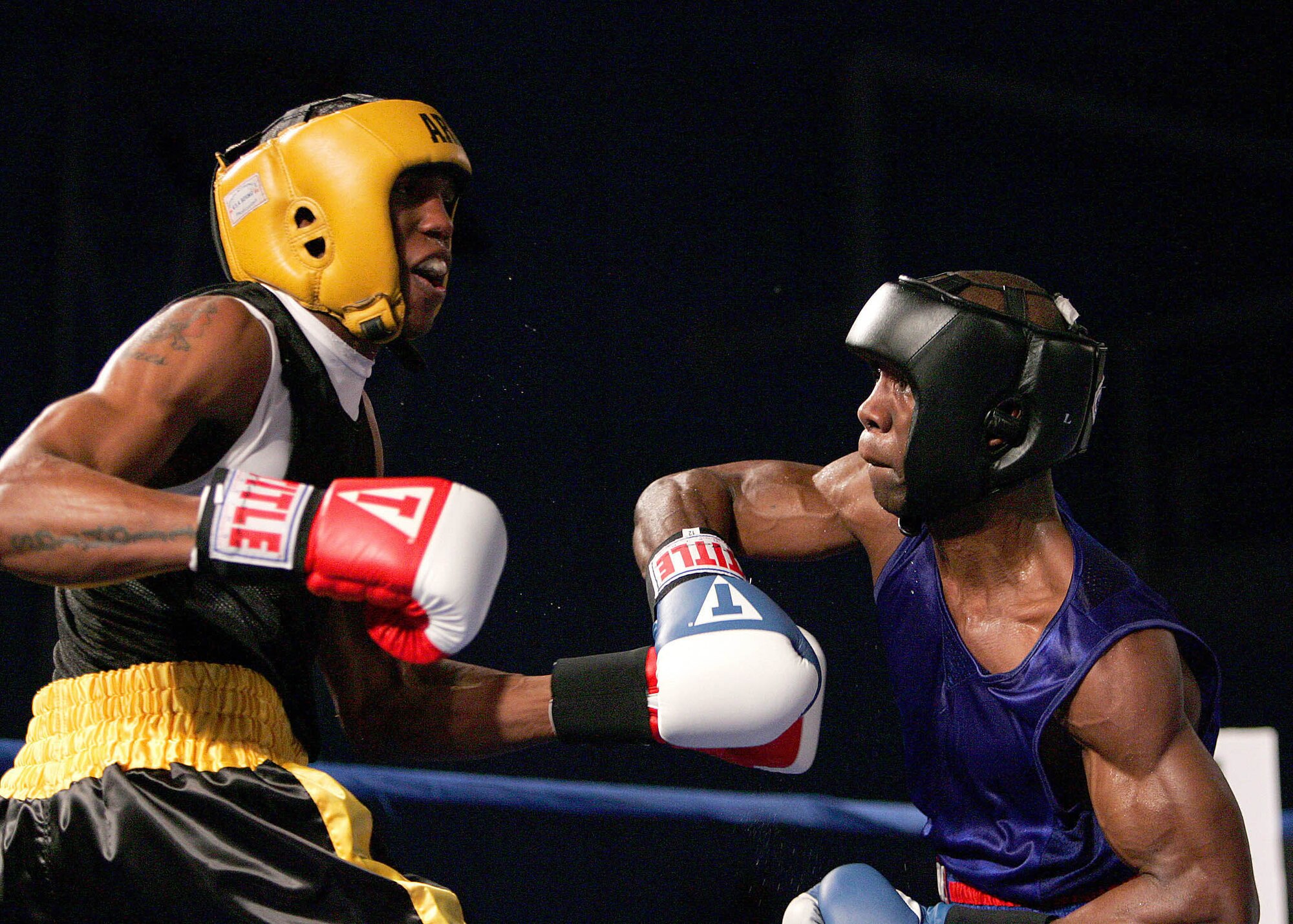 U.S. Army Spc Zacchaeus Hardrick, Fort Carson, Colo., defeated Air National Guardsman Gary Griffin, Stewart ANG, N.Y., Feb. 15 during their Armed Forces Boxing Championships bout at Lackland Air Force Base, Texas. (U.S. Air Force photo/Robbin Cresswell)